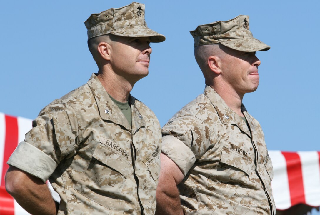 Lt. Col. Jay M. Bargeron (left) and Lt. Col. Kenneth M. DeTreux view the Marines and sailors of 2nd Battalion, 8th Marine Regiment, 2nd Marine Division, during a change of command ceremony here, May 24. DeTreux relinquished command of the unit to Bargeron after serving as the commanding officer from November 2005 to May 2007.