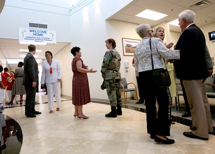 Attendees of the North Center Federal Clinic Open House ceremony tour the recently-opened facility on May 17. The 30,000-square foot outpatient clinic, located at 17440 Henderson Pass Road in San Antonio, is operated jointly by the Air Force and VA. It serves both VA and Department of Defense beneficiaries. The clinic will be staffed by four VA and four Air Force providers, offering services to approximately 10,000 veterans and military family members. Active-duty military members will continue to see their established primary care manager.
Specialty care will include mental health, nutrition, optometry, pediatrics and women?s health services. The clinic will also offer on-site pharmacy, laboratory and radiology services. (USAF photo by Robbin Cresswell) 