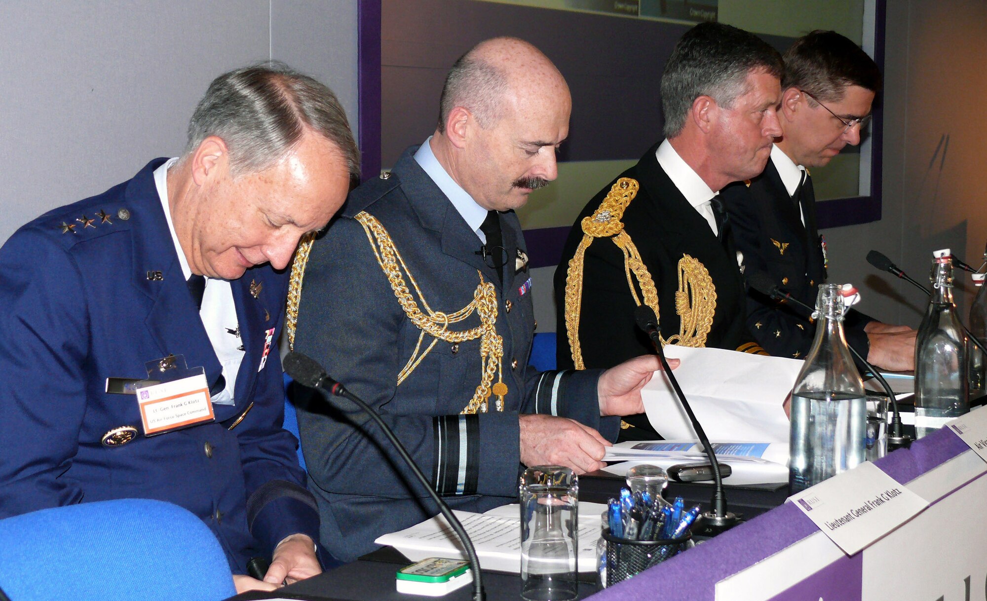 Lt. Gen. Frank G. Klotz (left), prepares for his speech at the Royal United Services Institute's air power conference in London May 24. Also shown are British Air Marshal T. M. Anderson, assistant chief of staff of the Royal Air Force, British Vice Adm. A. J. Johns, commander in chief of the British Naval Home Command and Rear Admiral Fleet Air Arm, and French Gen. D'Armee Abrial, French air force chief of staff. All were guest speakers at the conference to discuss challenges facing air power. General Klotz is vice commander of U.S. Space Command. (U.S. Air Force photo/Tech. Sgt. Scott Wakefield) 
