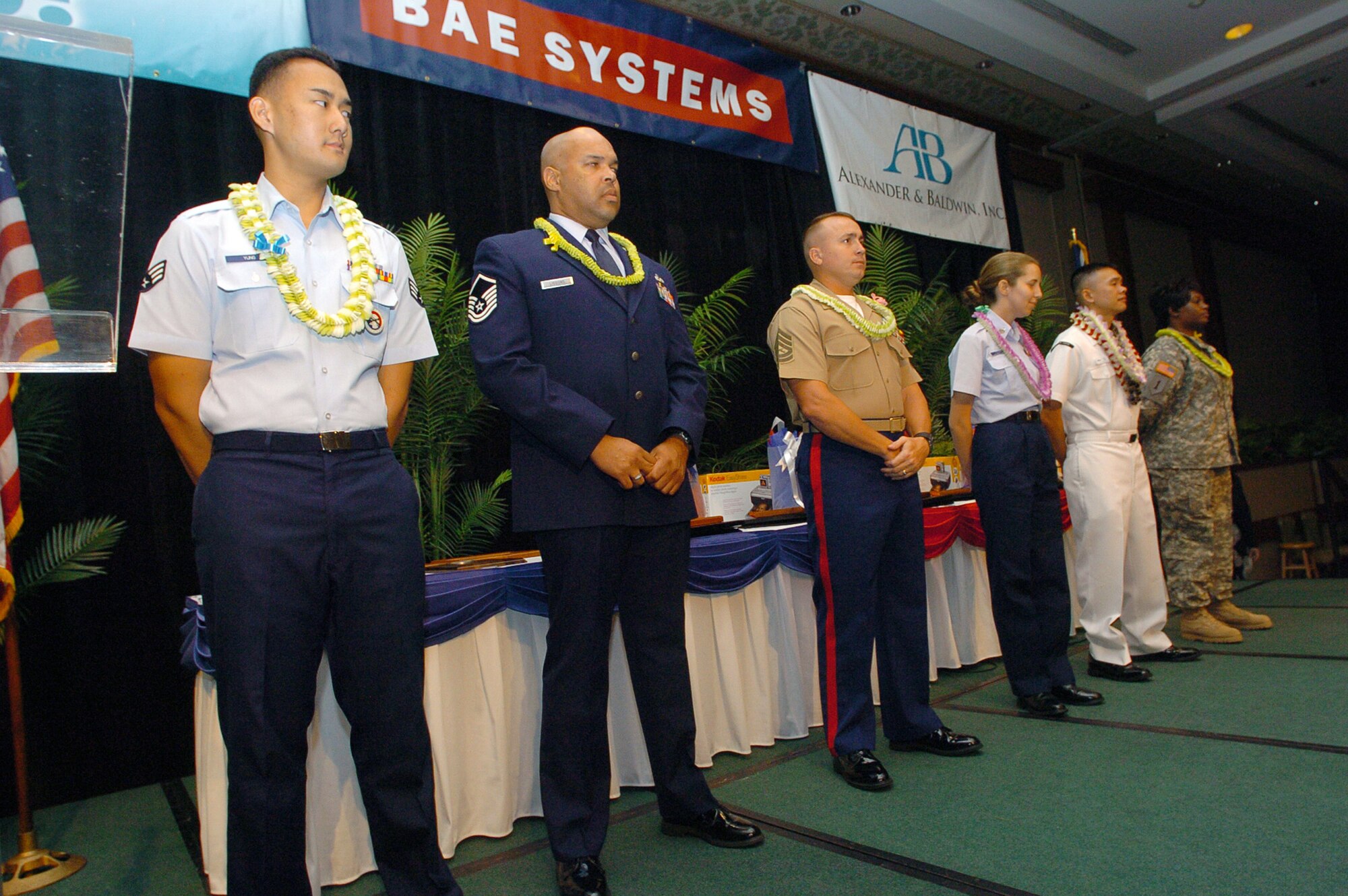 Members from each branch of service were presented a Community Service Award for Excellence in Community Outreach by the Honolulu Chamber of Commerce at the 22nd Annual Military Appreciation Month Luncheon May 24 at the Hilton Hawaiian Village in Honolulu. Members are (left to right) Hawaii Air National Guard Senior Airman Ryan Young, Master Sgt. Thomas Yaron, Marine Corps Staff Sgt. Crystal Havey, Coast Guard Petty Officer 1st Class Elizabeth Yeager, Navy Petty Officer Diem Ngo and Army Sgt. 1st Class Sharlinda Warner. (U.S. Air Force photo/Angela Elbern)
