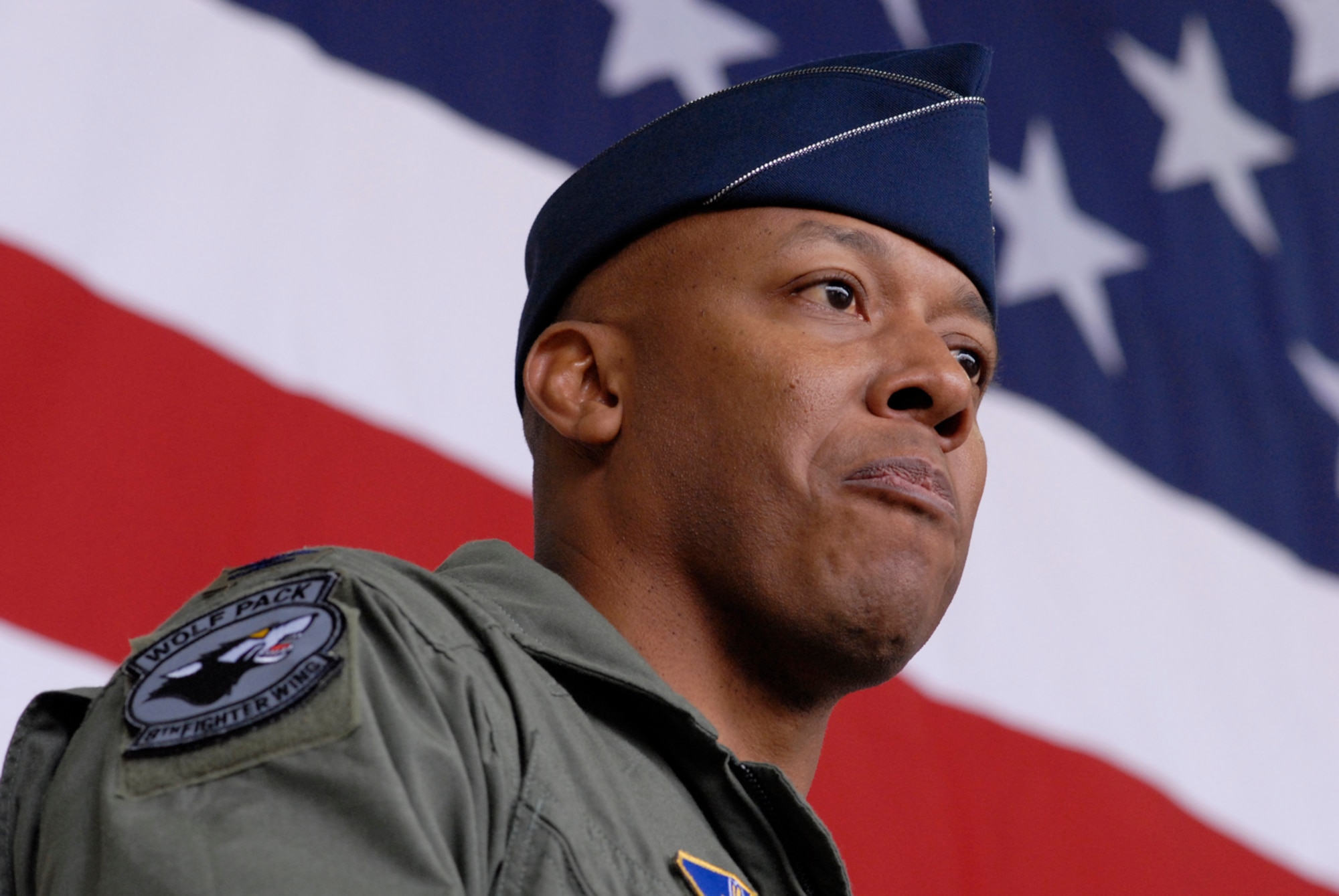 Colonel Charles "Wolf" Brown, the new 8th Fighter Wing commander, speaks to the wing for the first time during his change of command ceremony here May 25. During his speech, he said he will lead the Wolf Pack "using four tenets that have defined how I have operated during my career -- execute at a high standard, be disciplined in execution, pay attention to the details, and have fun." He was last assigned as commandant, U.S. Air Force Weapons School, 57th Wing, Nellis Air Force Base, Nev.  (U.S. Air Force photo by Senior Airman Barry Loo)