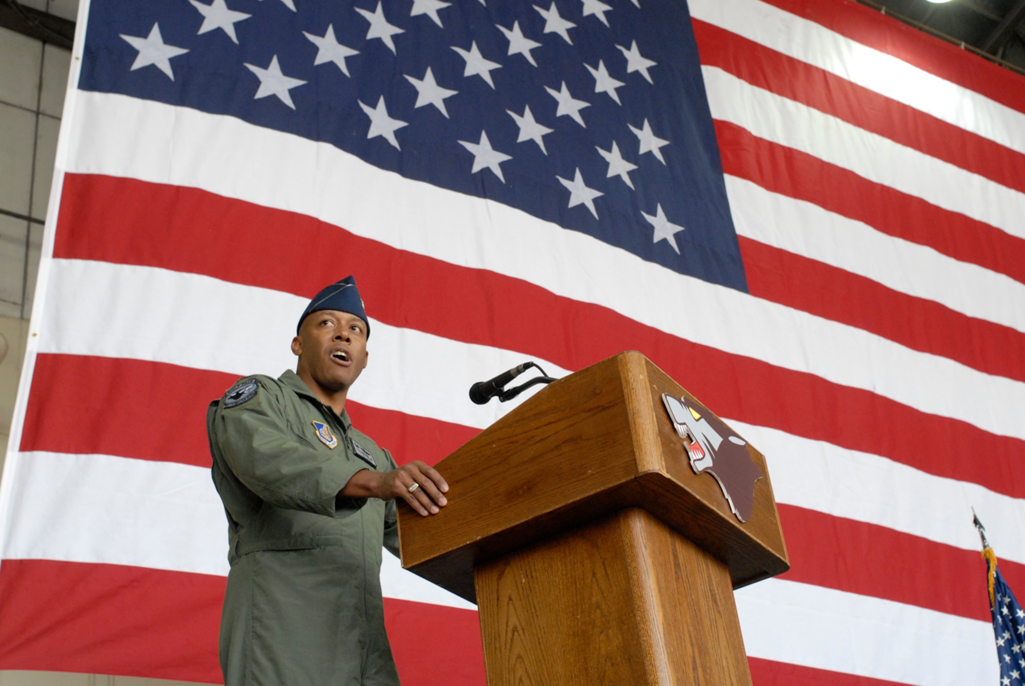 Colonel Charles "Wolf" Brown, the new 8th Fighter Wing commander, speaks to the wing for the first time during his change of command ceremony here May 25. During his speech, he said he will lead the Wolf Pack "using four tenets that have defined how I have operated during my career -- execute at a high standard, be disciplined in execution, pay attention to the details, and have fun." He was last assigned as commandant, U.S. Air Force Weapons School, 57th Wing, Nellis Air Force Base, Nev.  (U.S. Air Force photo by Senior Airman Barry Loo)