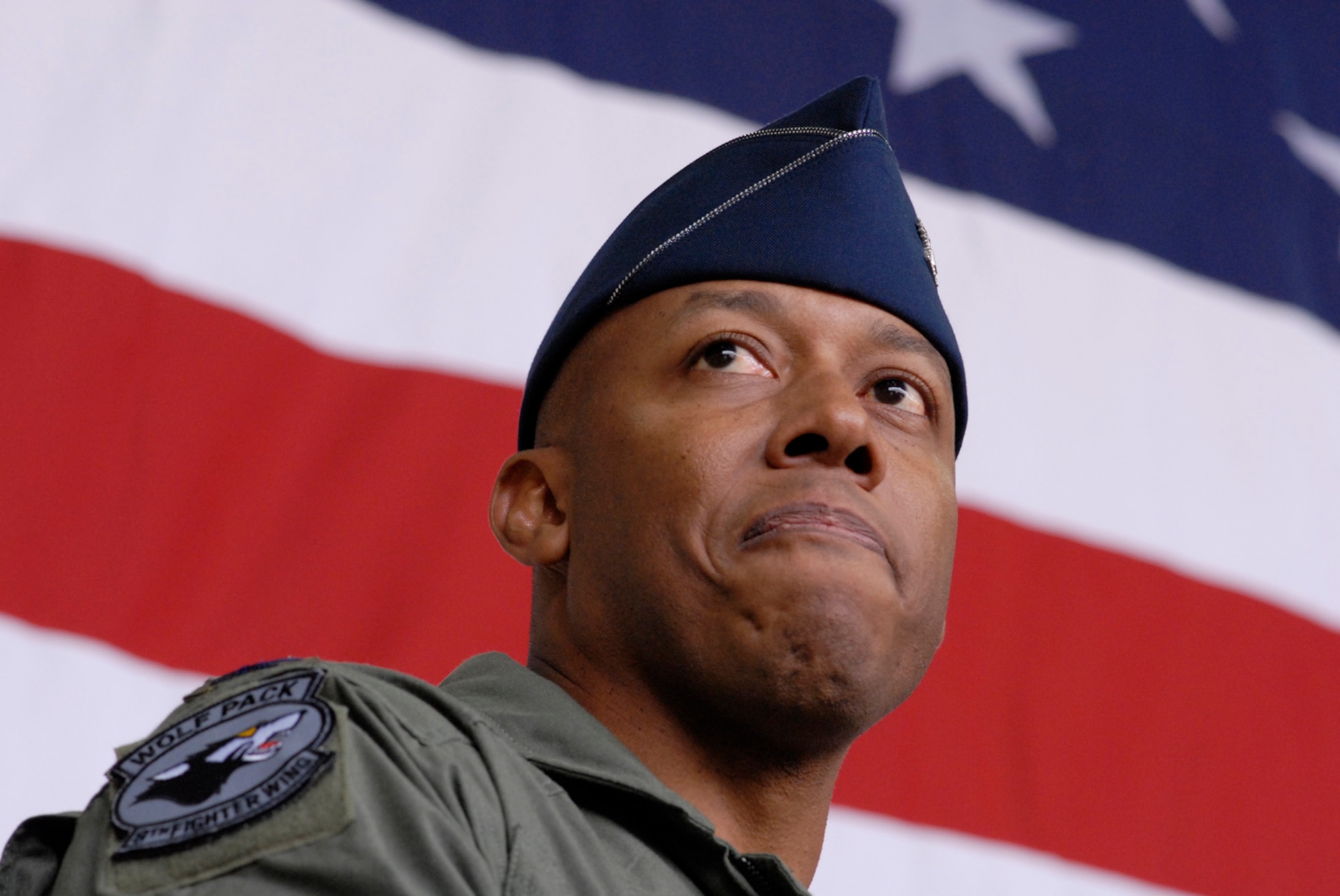 Colonel Charles "Wolf" Brown, the new 8th Fighter Wing commander, speaks to the wing for the first time during his change of command ceremony here May 25. During his speech, he said he will lead the Wolf Pack "using four tenets that have defined how I have operated during my career -- execute at a high standard, be disciplined in execution, pay attention to the details, and have fun." He was last assigned as commandant, U.S. Air Force Weapons School, 57th Wing, Nellis Air Force Base, Nev.  (U.S. Air Force photo by Senior Airman Barry Loo)