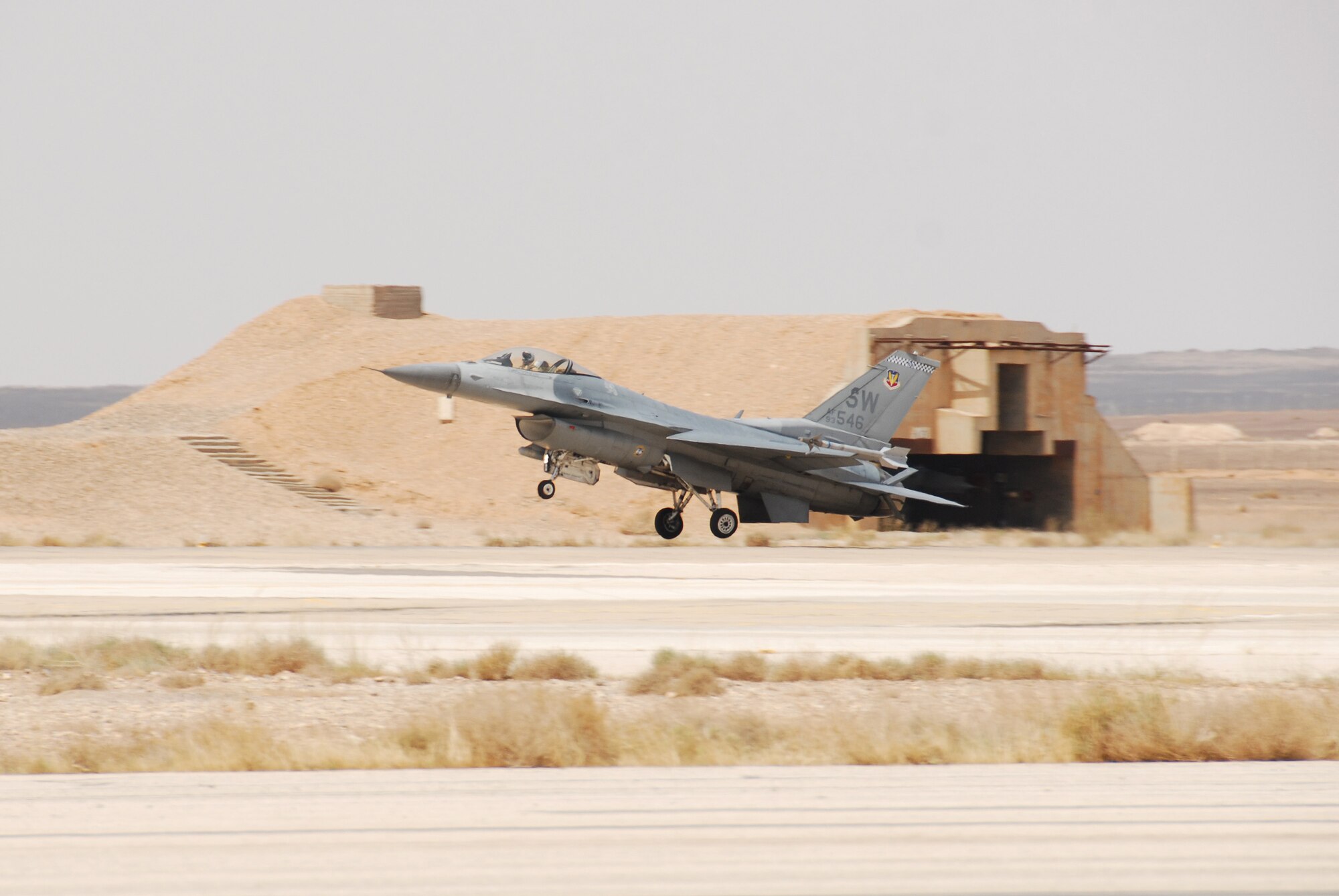 An F-16 Fighting Falcon lands May 20 after performing a training mission of basic fighter maneuvers during the 2007 Falcon Air Meet in Azraq, Jordan. The event was founded by Jordan's Royal Highness Prince Feisal Bin Al Hussein to get F-16 users in the region to exercise and exchange information. Air forces from Jordan, Turkey, Belgium and the United States participated in the 2007 FAM. (U.S. Air Force photo/Tech. Sgt. Wolfram Stumpf)