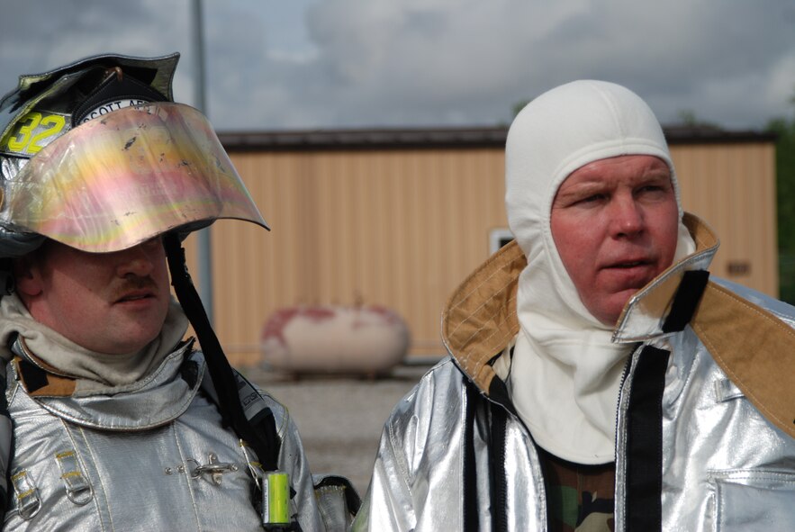 Suited up for his first firefight, 932nd Airlift Wing Command Chief Master Sgt. Merle Lyman starts to feel the warmth of the suit at Scott Air Force Base.