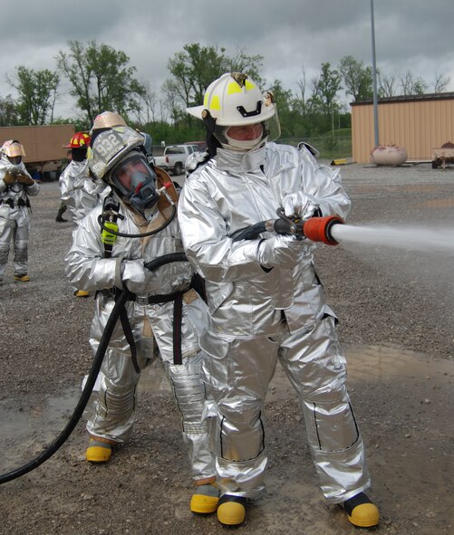 932nd Airlift Wing firefighting Reservists showed Command Chief Master Sgt. Merle Lyman how to put out fires Illinois!  Photo/Capt. Stan Paregien