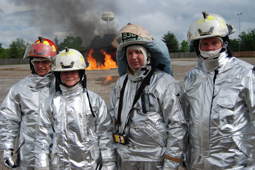 932nd firefighting at its best in Illinois.  932nd Airlift Wing firefighting Reservists showed their commander Col. Maryanne Miller (second from left) how to put out fires Illinois!  Photo/Capt. Stan Paregien