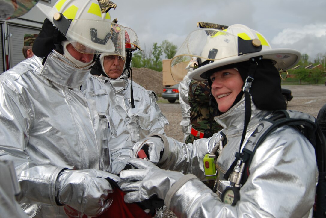 932nd Airlift Wing Command Chief Master Sgt. Merle Lyman, Col. James Patterson and 932nd Airlift Wing commander Col. Maryanne Miller, prepare for firefighting at its best in Illinois.