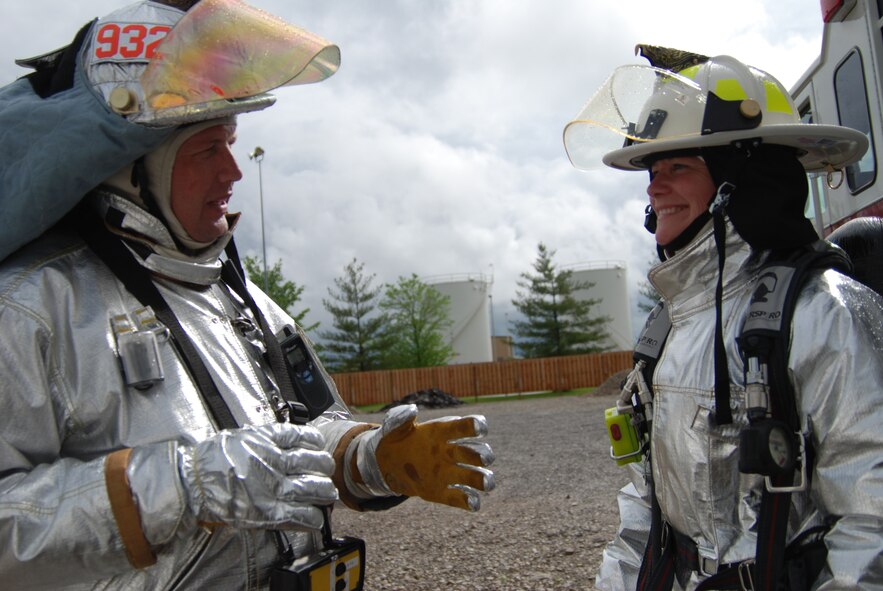 932nd firefighting at its best in Illinois.  932nd Airlift Wing firefighting Reservists showed their commander how to put out fires on a warm muggy day. Photo/Capt. Stan Paregien