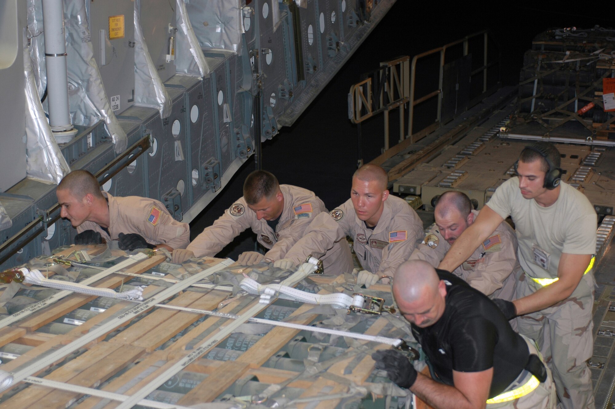 (From left) Staff Sgt. Greg Rada, 816th Expeditionary Airlift Squadron loadmaster, from Southbury Conn.; Staff Sgt. John Quick, 436th Security Forces Squadron Raven, from Port Jervis, N.J.; Senior Airman Dale Adkins, 436 SFS Raven, from Harwinton, Conn.; and 1st Lt. Alex Hanna, 816 EAMS copilot; along with two Airmen from a forward-deployed location, upload about 180 pallets of ammunition to deliver to Rafic Harari International Airport in Beirut, Lebanon. The C-17 Globemaster III is capable of rapid delivery of troops and cargo to any location worldwide. It’s the newest and most flexible airlift asset in the Air Force inventory. The 816th maintained operations in Iraq and Afghanistan while supporting the effort to re-supply the Lebanon Armed Forces from their strategic location in Southwest Asia. The squadron has flown 850 sorties in May, to include the ammunition re-supply mission, cargo and passenger movement and Joint Precision Guided Air Drops. (U.S. Air Force photo/Capt. Teresa Sullivan)