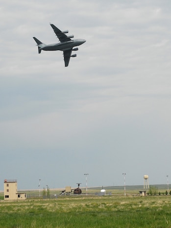 A C-17 Globemaster performed a fly over at Malmstrom Air Force Base's open house and air show May 20. (U.S. Air Force photo by John Turner)