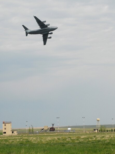 A C-17 Globemaster performed a fly over at Malmstrom Air Force Base's open house and air show May 20. (U.S. Air Force photo by John Turner)