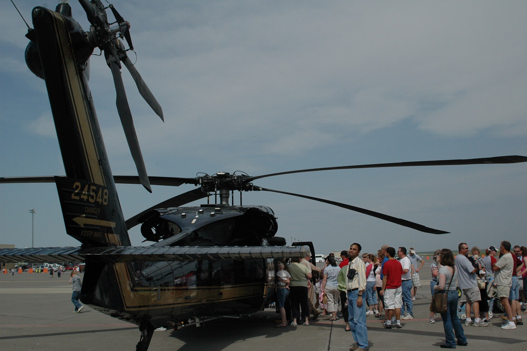 Community members gather around the Department of Homeland Security's HH-60 Pave Hawk helicopter that was one of the static displays at Malmstrom's open house and air show May 20 and 21. (U.S. Air Force photo by Airman 1st Class Emerald Ralston)