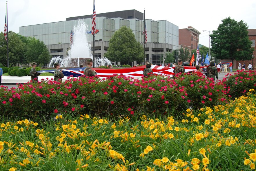 With many flowers in full bloom, members of the 932nd Airlift Wing march through downtown Belleville during the 2007 Belleville Memorial Day parade.