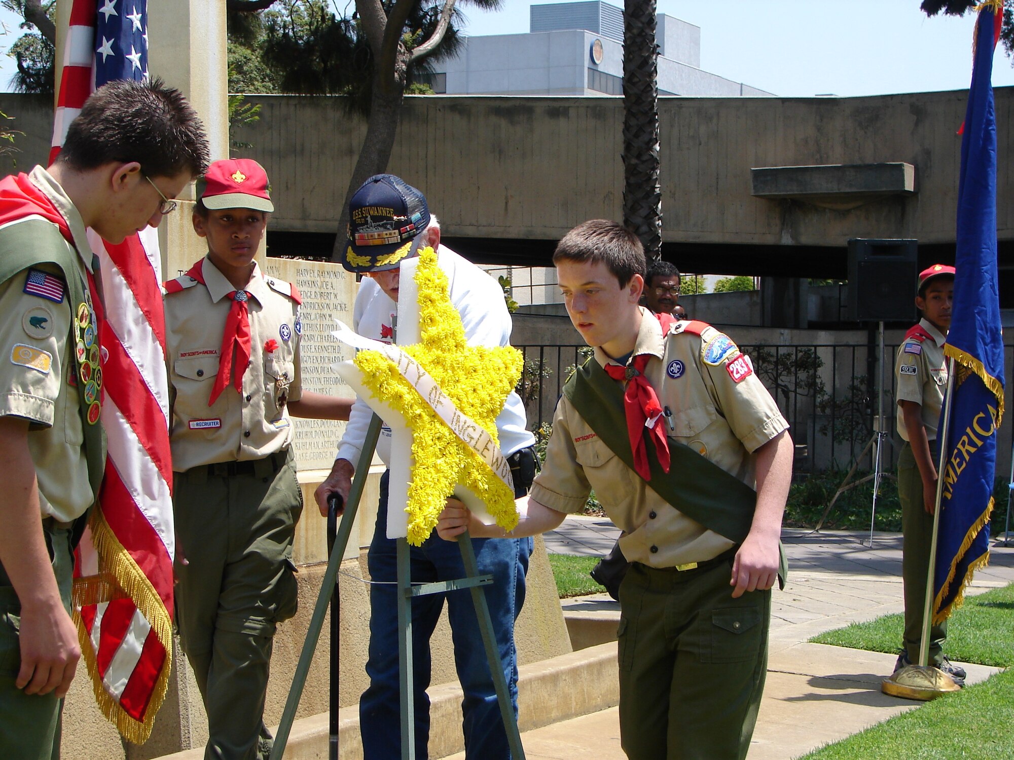 Aided by members of Boy Scout Troop 283, a WW II vet placed flowers at the 59th Annual Inglewood Memorial Day Service, May 28. The service honored fallen heroes from the city and was attended by veterans who served from World War II to Operation Iraqi Freedom. Col. Douglas Kendall, Spacelift Range Group Commander was the keynote speaker.