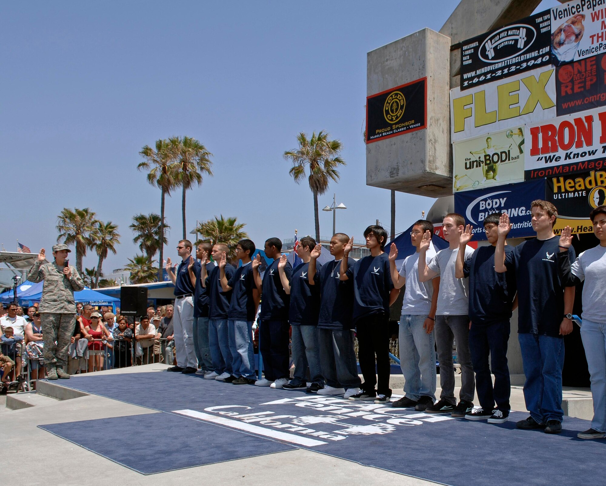 Brig. Gen. Ellen Pawlikowski, Military Satellite Systems Wing Commander, swears in new recruits at the Muscle Beach Memorial Day celebration in Venice, Calif., May 28