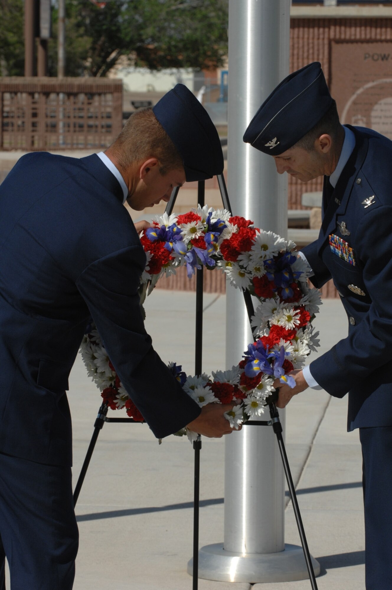 Airman Basic Jesse Hubbard, 49th Civil Engineer Squadron, and Col. Jack Forsythe, 49th Operations Group commander, lay a wreath in honor of those POW/MIA and fallen comrades. (U.S. Air Force photo by Senior Airman Anthony Nelson)