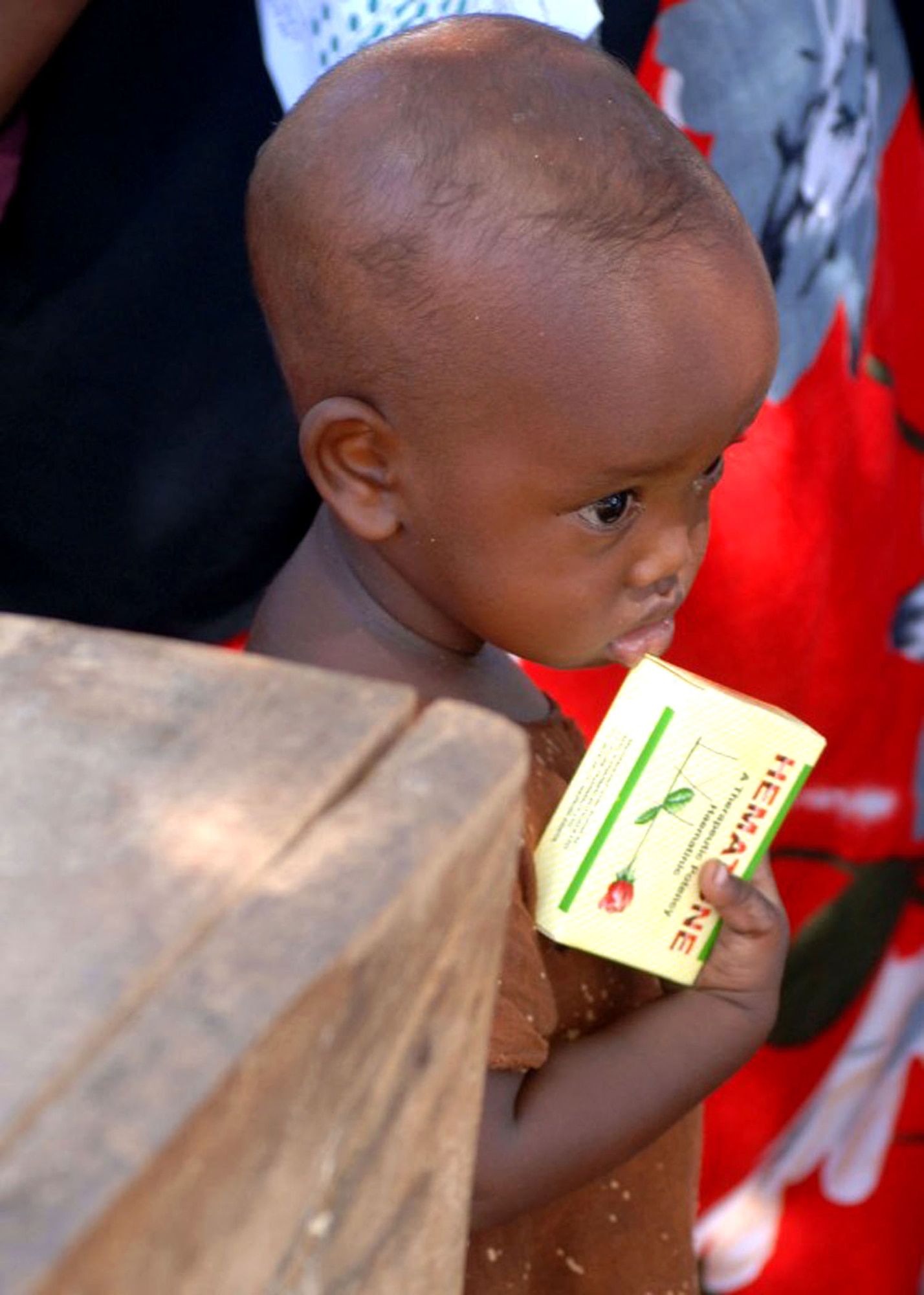 A child holds a box of medication during a Combined Joint Task Force - Horn of Africa Medical Civic Action Program in May in Kenya. CJTF-HOA servicemembers conducted the MEDCAP in the villages of Shimbir and Balich through a partnership with the Kenyan department of defense, which provided additional medical providers and logistical support. More than 1,000 people received healthcare as part of the project. (U.S. Air Force photo/Tech. Sgt. Carrie Bernard) 
