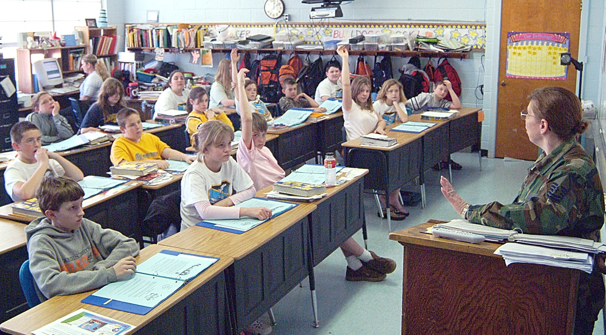 Master Sgt. Claudia Spooner (right), a volunteer teacher from the 442nd Fighter Wing's, 442nd Mission Support Flight, instructs students during the wing-sponsored Wright Flight mentoring program at Hardin Central school in Hardin, Mo. The 442nd FW is an Air Force Reserve Command A-10 Thunderbolt II fighter unit based at Whiteman Air Force Base, Mo. (US Air Force photo/Master Sgt. Bill Huntington)