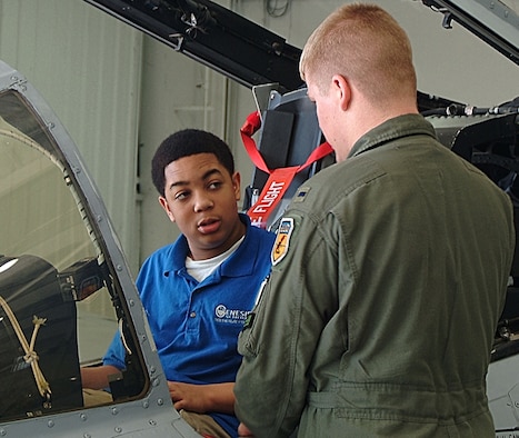 1st Lt. John Tice (right), a pilot with the 442nd Fighter Wing's 303rd Fighter Squadron, answers a visiting student's questions about the A-10 Thunderbolt II. Students from the Genesis School in Kansas City, Mo., and three other area schools, toured the A-10 and its facilities as a reward for successful completion of the Wing-sponsored Wright Flight mentoring program. The 442nd FW is an Air Force Reserve Command A-10 Thunderbolt II fighter unit based at Whiteman Air Force Base, Mo. (US Air Force photo/Master Sgt. Christina Suratos)