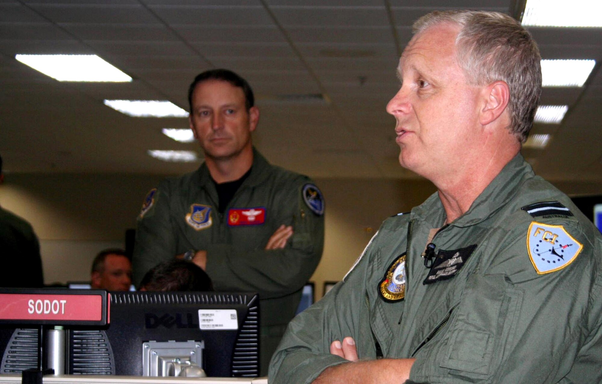 Royal Australian Air Force Air Vice Marshall Mark Binskin briefs the staff on the operations floor of the 613th Air and Space Operations Center May 24 during Exercise Talisman Saber while Col. Mike Boera listens. Air Vice Marshall Binskin was the Combined Forces Air Component Comannder for the exercise, with Colonel Boera his deputy CFACC. Colonel Boera is the 613th Air and Space Operations Center commander. (U.S. Air Force photo/Capt. Yvonne Levardi) 
