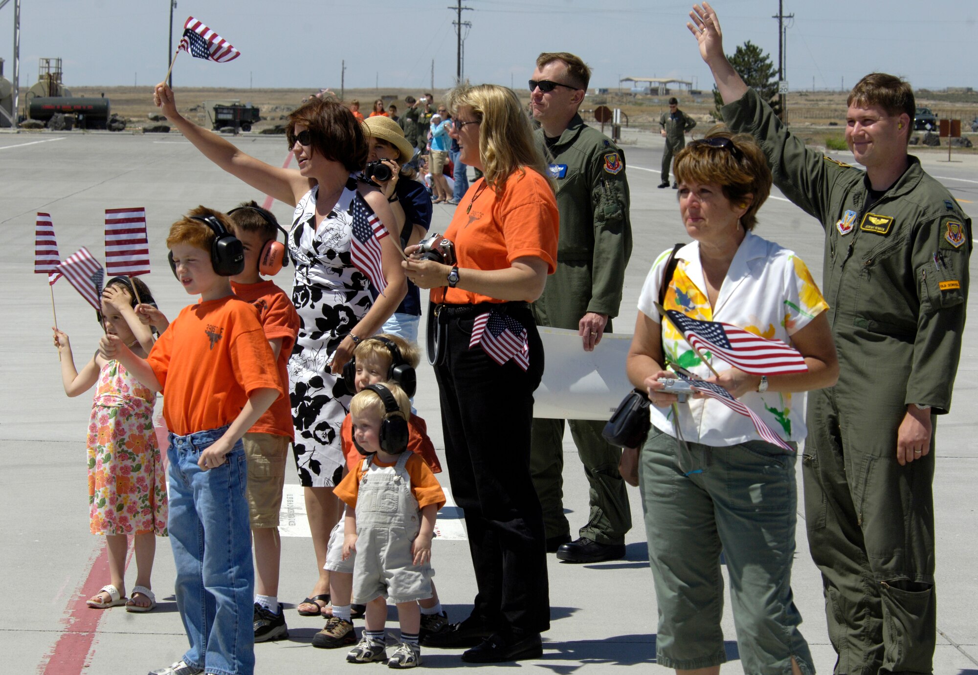 MOUNTAIN HOME AIR FORCE BASE, Idaho -- Families of military members from the 391st Fighter Squadron wait as more than a dozen F-15E Strike Eagle jets and nearly 30 aircrew members fly into Mountain Home May 23 after a historic, four-month deployment to Afghanistan. The fighter squadron became the first F-15E unit to deploy to Afghanistan. The Bold Tigers flew more than 1,000 combat missions out of Bagram Air Base to support operations Iraqi and Enduring Freedom. (U.S. Air Force photo/Airman 1st Class Ryan Crane)