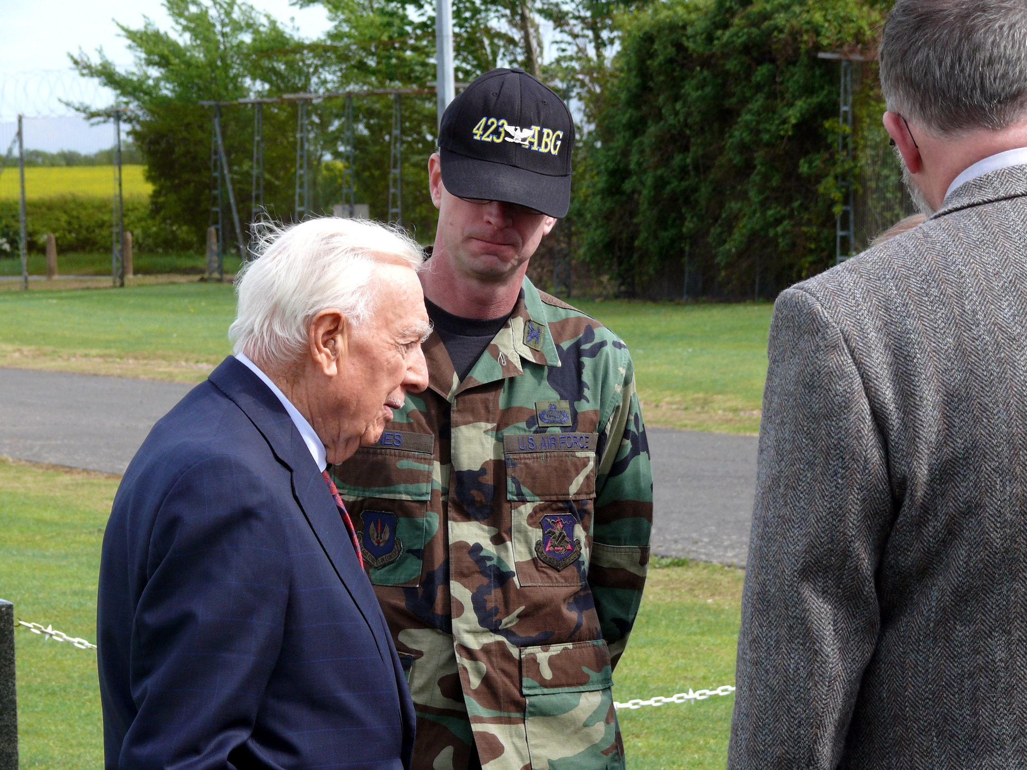 Walter Cronkite talks to Col. Jack Jones in front of the 303rd Bomb Group Memorial just outside the main gate May 29 at Royal Air Force Molesworth, England. Colonel Jones is the 423rd Air Base Group commander. (U.S. Air Force photo/Tech. Sgt. Scott Wakefield) 