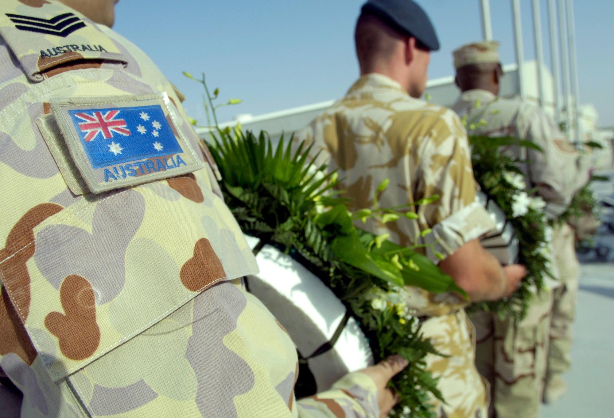 Coalition partners from several countries gathered May 28 at this deployed location in Southwest Asia to participate in a Memorial Day ceremony. Originally known as Decoration Day, Memorial Day ceremonies are a time to pay tribute to servicemembers who have paid the ultimate sacrifice in securing freedom. (U.S. Air Force photo/Master Sgt. Jim Varhegyi) 
