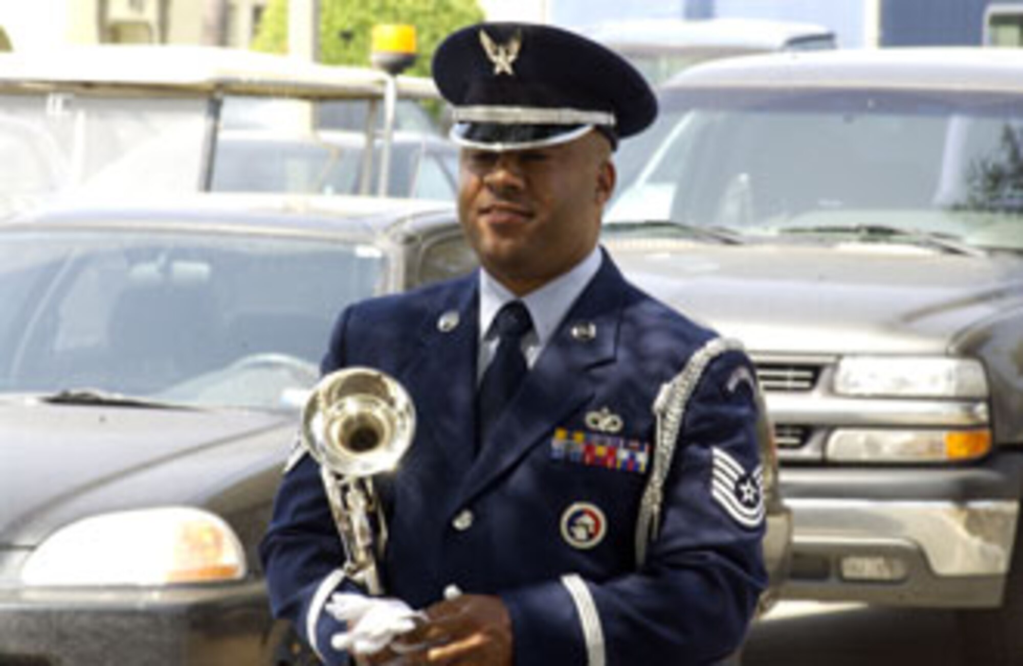 Technical Sgt. Michael Booker fulfilled a time honored tradition of playing
taps on the bugle during the Memorial Day service. Several hundred Airmen showed up in front of the 452nd Air Mobility Wing headquarters building Sunday afternoon to participate in a very special commander’s call at March Air Reserve Base. Standing in formation were representatives from every unit on base as well as the local Civil Air Patrol squadrons. Brig. Gen. James Melin, the 452nd commander, took time to address his troops as well as speak about the upcoming Memorial Day and its significance to all of us who proudly wear a military uniform. This time honored tradition of holding commander’s call at Wing HQ has years of historic value dating back to the days when past commanders -- including General Henry “Hap” Arnold, who took command of March Field in 1931 -- used to address Airmen from the balcony of the HQ building. (U.S. Air Force photo by Tech. Sgt. Michael Blair)
