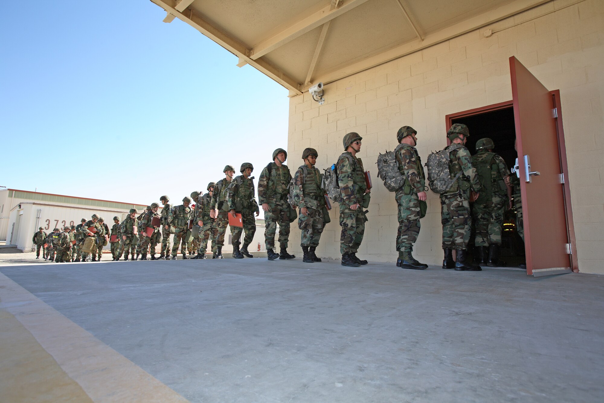 Edwards Airmen process for deployment during a Phase 1 exercise here May 23. The exercise was in preparation for the upcoming Air Force Materiel Command Inspector General Phase I re-look July 30 after the base received an unsatisfactory rating for "initial response" during March's Operational Readiness Inspection. (Photo by Jet Fabara)