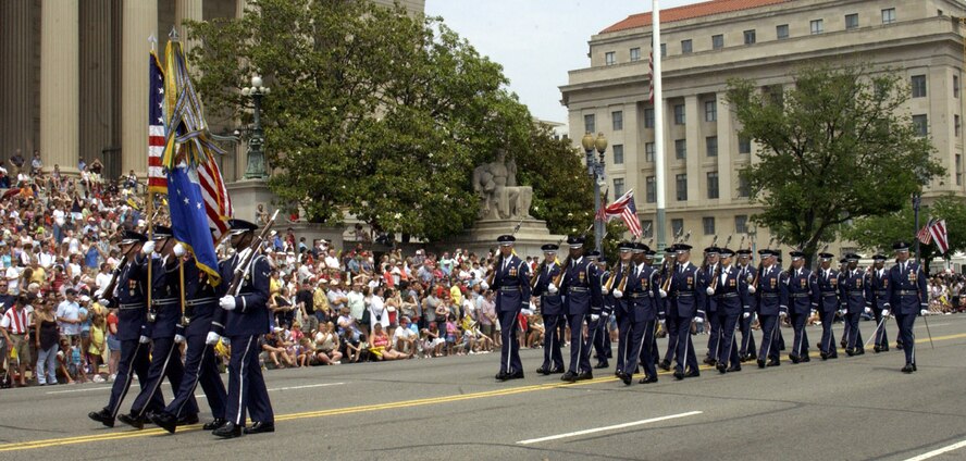 Airmen from the U.S. Air Force Honor Guard march in front of the National Archives during the National Memorial Day Parade Monday. The parade highlighted the Air Force's 60th anniversary as a separate service and featured several well-known Airmen. Maj. Gen. Robert L. Smolen, Air Force District of Washington commander, served as the grand marshall for the parade; Secretary of the Air Force Michael Wynne and Chief Master Sgt. of the Air Force Rodney McKinley attended as well. In addition, members from all services represented the efforts of fighting men and women through every war and conflict since the early days of the nation. (U.S. Air Force photo by Staff Sgt. J.G. Buzanowski) 