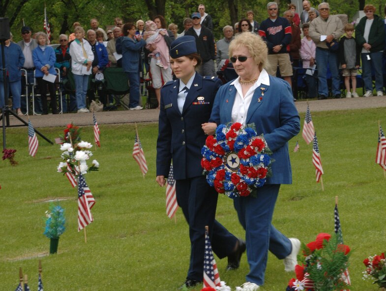 MINOT AIR FORCE BASE, N.D. – Second Lt. Kelly Barton, 5th Civil Engineer Squadron, and Delores Walhood, American Legion Auxiliary Unit 26 president, lay a wreath at the Soldier’s Plot in Rosehill Cemetery in Minot during a Memorial Day ceremony May 28. The ceremony was held in conjunction with veterans organizations and auxiliaries, Rosehill Memorial Park and Minot Air Force Base. (U.S. Air Force photo by Senior Airman Stacy Moless) 