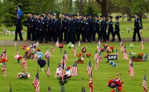 MINOT AIR FORCE BASE, N.D. – Airmen from the 5th Communications Squadron and 5th Civil Engineer Squadron march through Rosehill Cemetery in Minot during a Memorial Day ceremony May 28. Memorial Day commemorates U.S. men and women who have died in military service. (U.S. Air Force photo by Senior Airman Stacy Moless) 