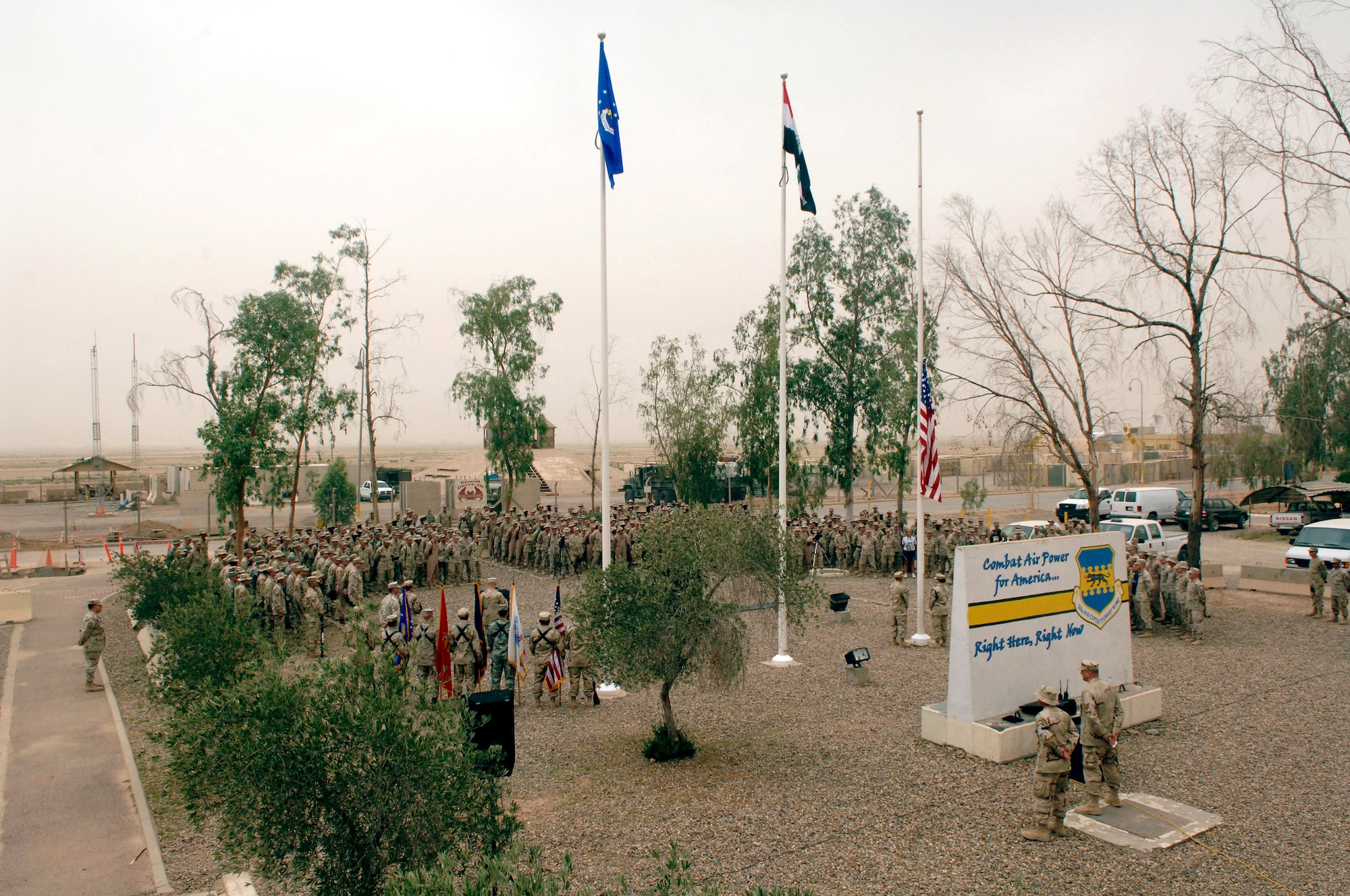 More than 300 Airmen from the 332nd Air Expeditionary Wing share a moment of silence in front of the Fallen Airman Memorial May 28 at Balad Air Base, Iraq. Thirty-three Airmen's names are inscribed on the memorial, including the wing's most recent loss, Staff Sgt. John Self. The sergeant, a security forces defender with the Det. 3, 732nd Expeditionary Security Forces Squadron at Camp Liberty, Baghdad, was killed May 14 while conducting a combat patrol in the Rasheed District of Baghdad. (U.S. Air Force photo/Airman 1st Class Jonathan Steffen)