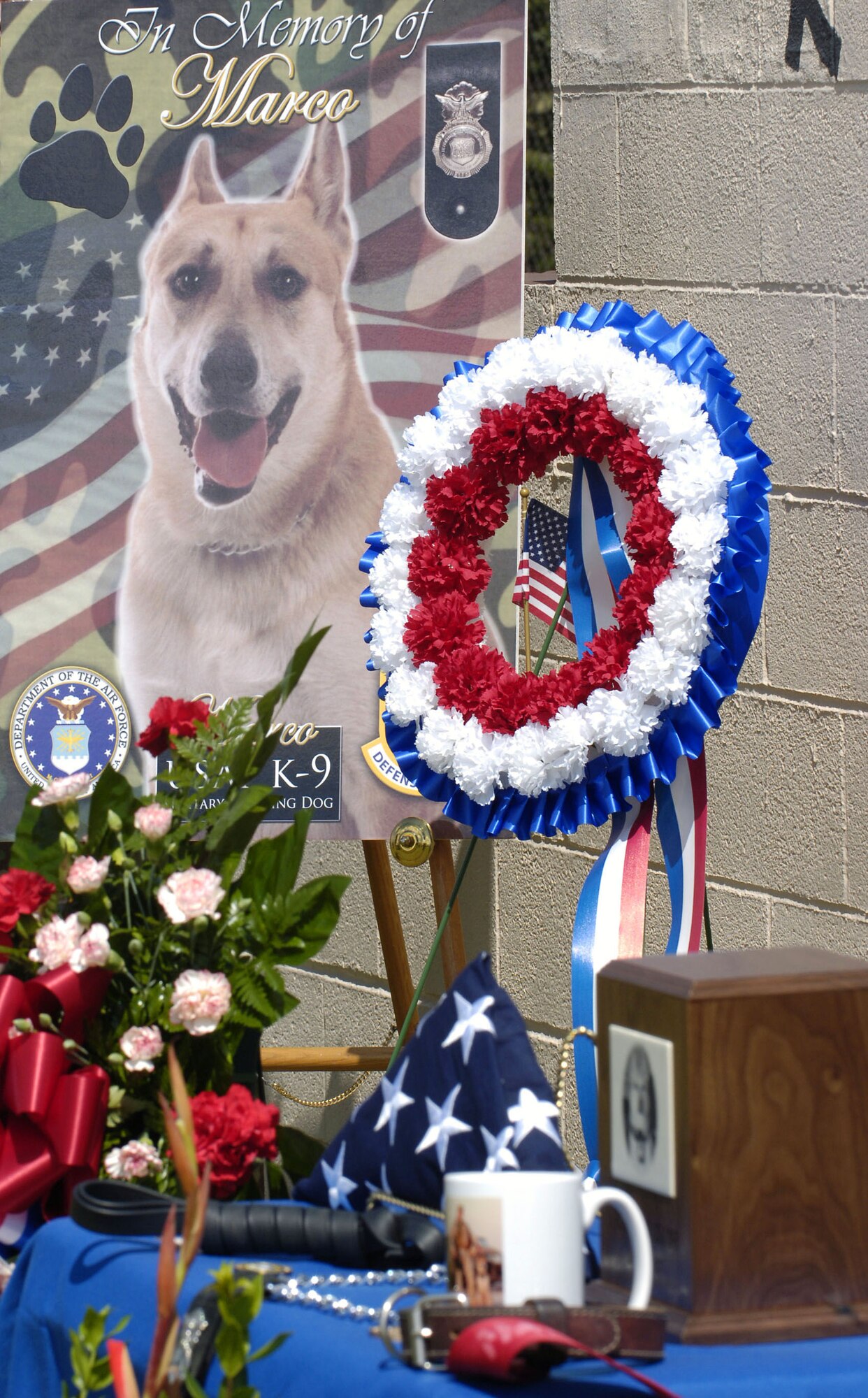 A display stands in memory of Marco, a military working dog killed Jan. 19 while on patrol in Baghdad, Iraq, during a recent memorial ceremony at Tinker Air Force Base, Okla.  Marco was assigned to the 72nd Security Forces Squadron at Tinker.  (U.S. Air Force photo by Dave Faytinger)
