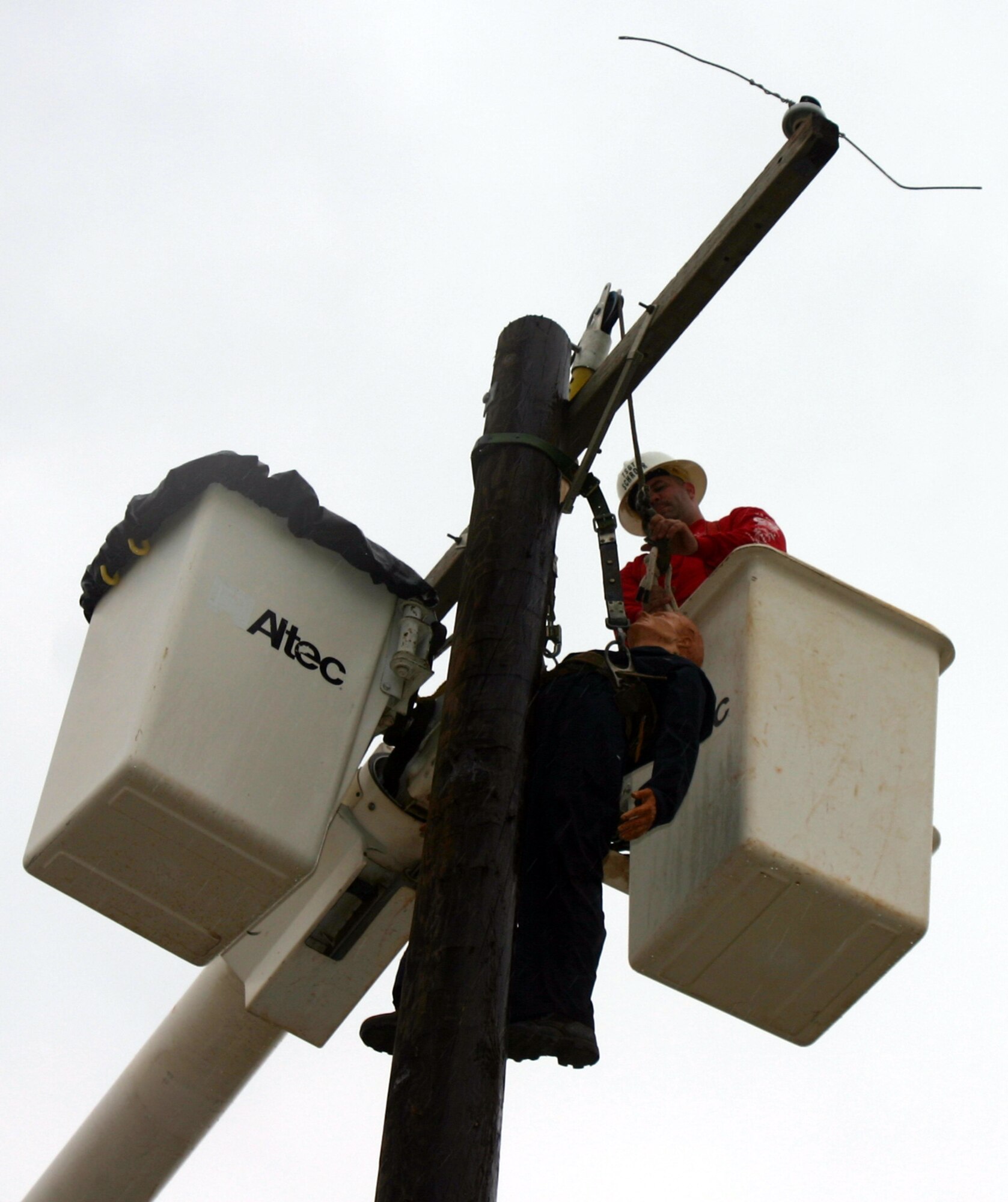 Tech. Sgt. Kristian Schroer, 366th Training Squadron, sets up the hurt man rescue challenge for the next contestant at the Linemen's Rodeo May 19. (U.S. Air Force photo/Staff Sgt. Tonnette Thompson)