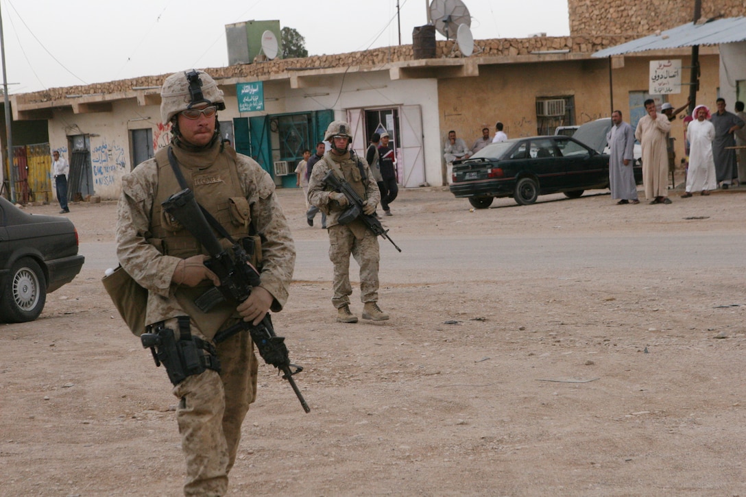Marines with Company B, 1st Battalion, 2nd Marine Regiment, patrol through the city of Rutbah. Patrols are routinely sent out in efforts to locate, prevent and disrupt any insurgent activity in the area.