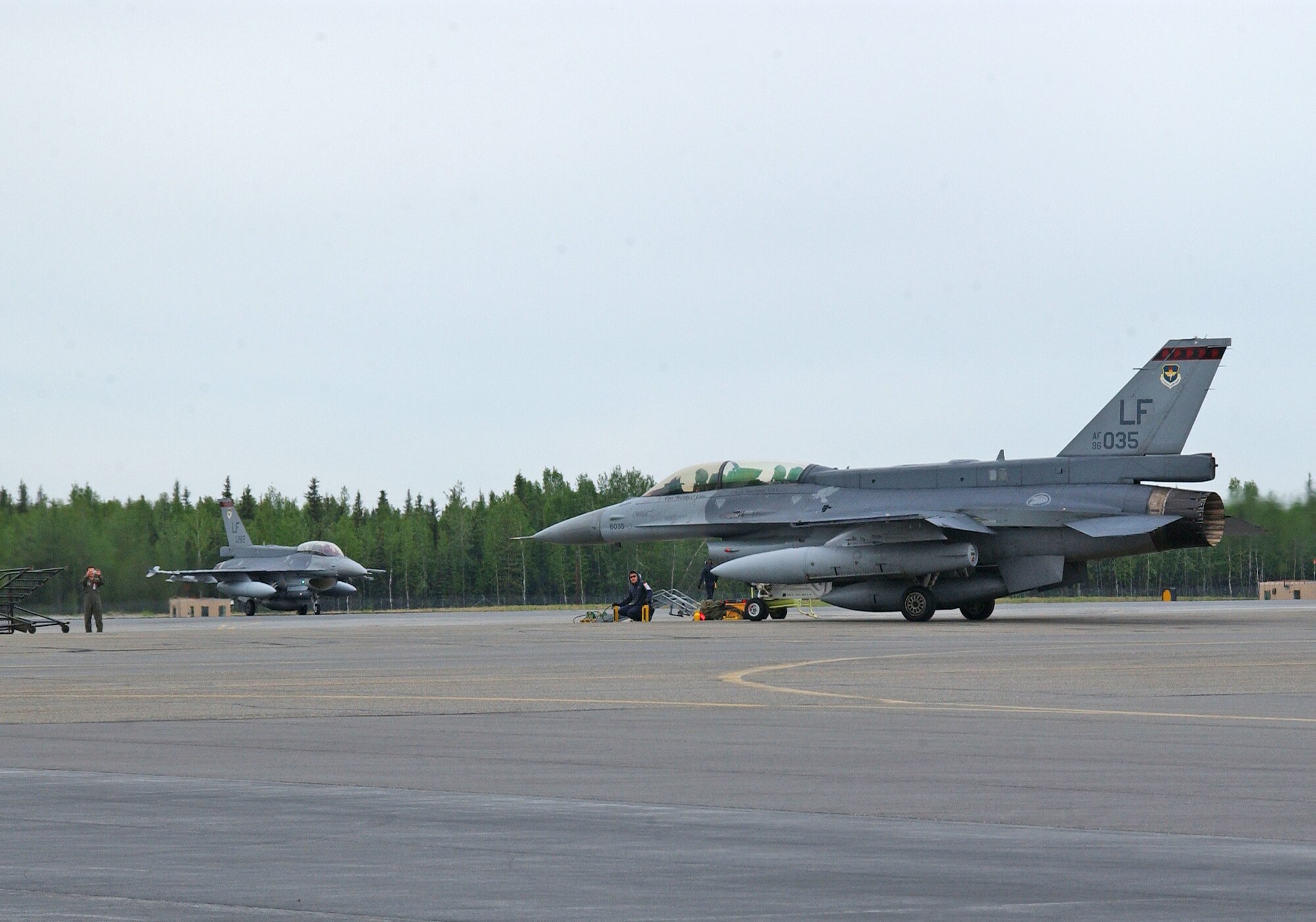 EIELSON AIR FORCE BASE, Alaska--Two Republic of Singapore air force F-16s taxi down the runway here May 30 for Red Flag-Alaska 07-2. Red Flag-Alaska, a series of Pacific Air Forces commander-directed field training exercises for U.S. forces, provides joint offensive counter-air, interdiction, close air support, and large force employment training in a simulated combat environment. (U.S. Air Force photo by Senior Airman Justin Weaver).                     