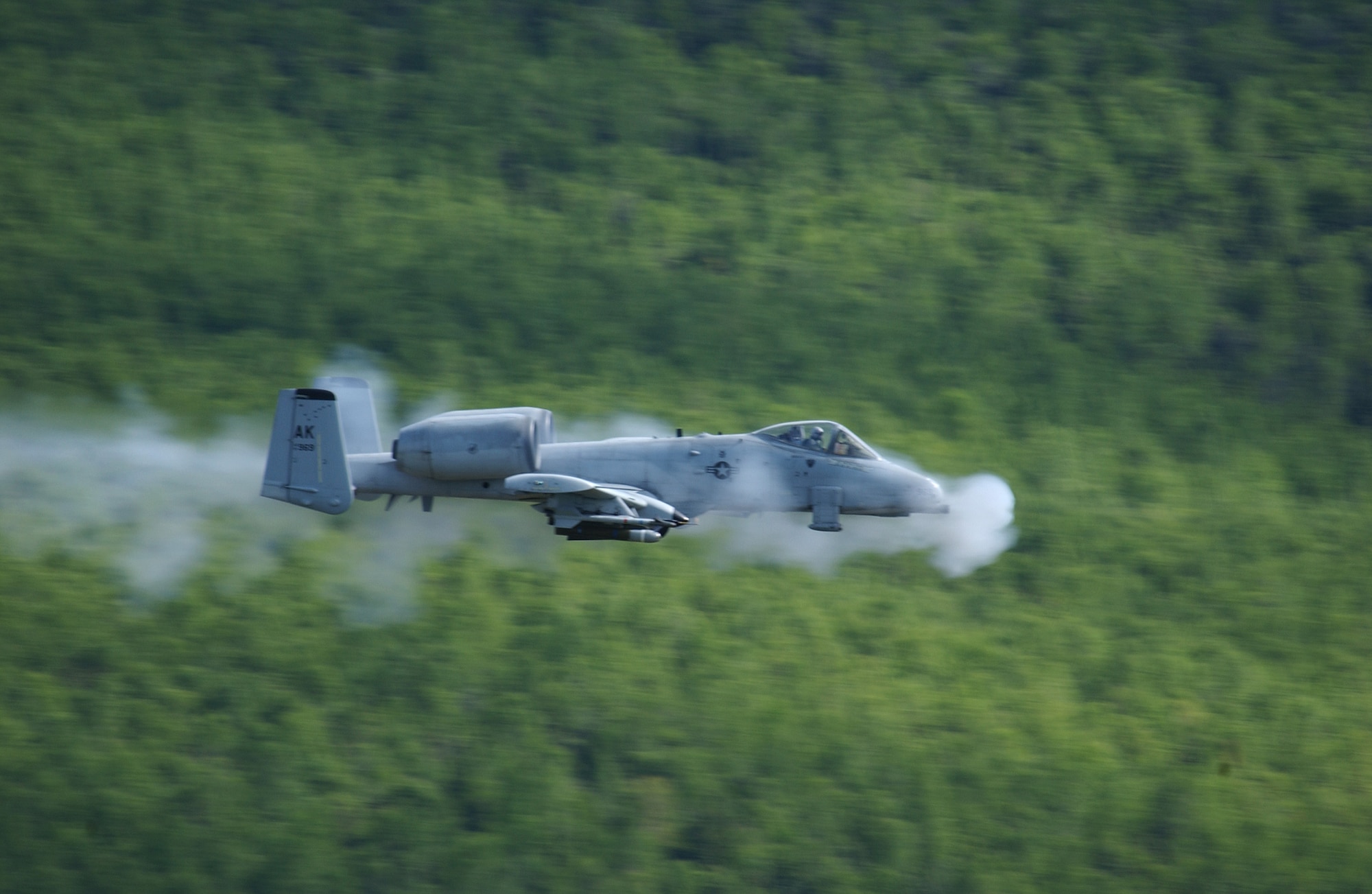 EIELSON AIR FORCE BASE, Alaska -- An A/OA-10 Thunderbolt II aircraft from the 355th Fighter Squadron fires a 30mm GAU-8 Avenger seven-barrel Gatling gun at a rate of 3,900 rounds a minute May 29 over the Pacific Alaska Range Complex. The 355th FS's primary missions include air strike control, close air support, target interdiction, joint air attack team, combat escort, and combat search and rescue. (U.S. Air Force Photo by Airman 1st Class Jonathan Snyder) 