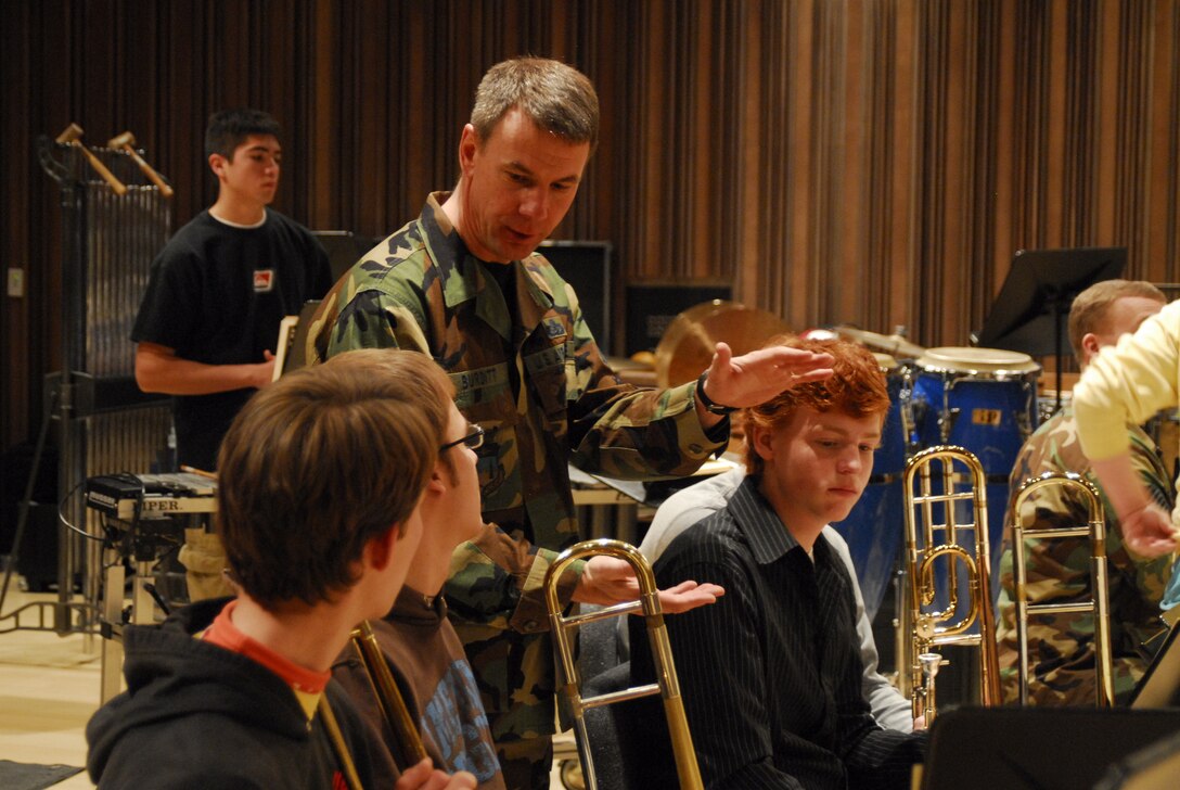 SMSgt Mark Burditt coaches high school trombone students during a rehearsal for the 2007 Colorado All-State Jazz Band.