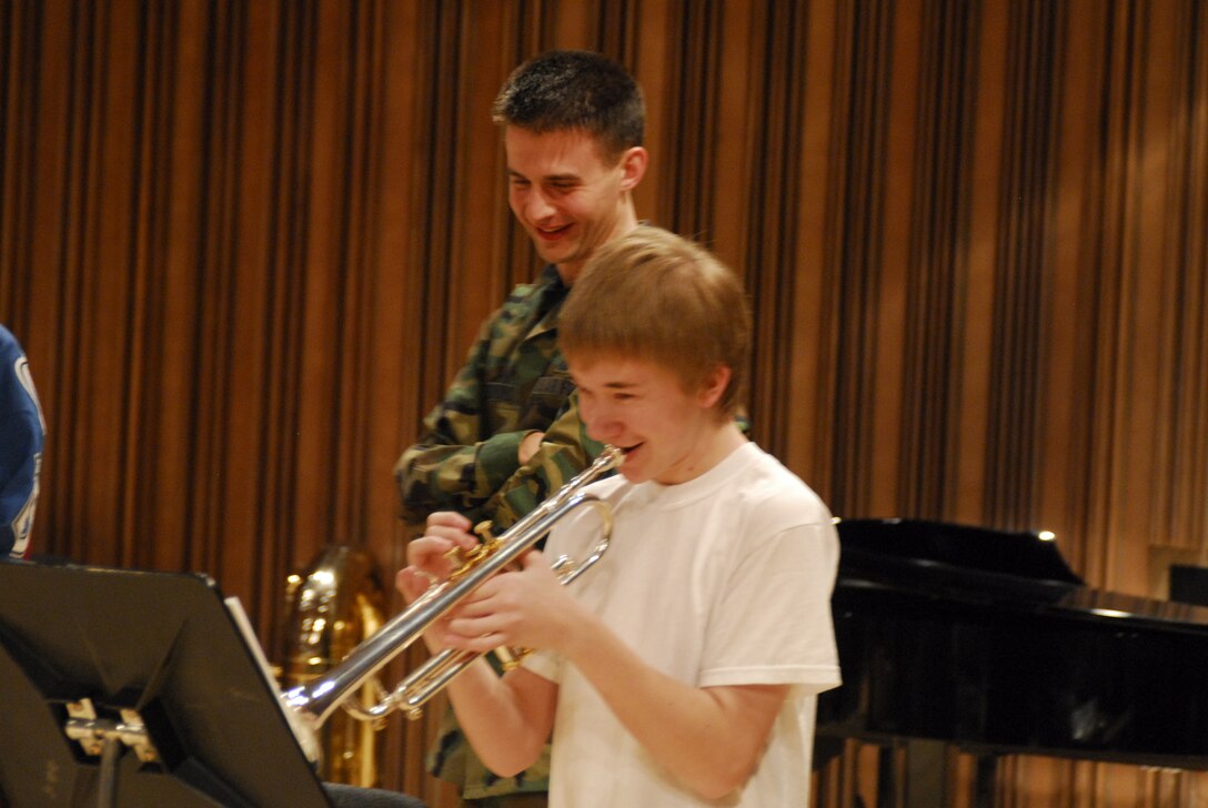 TSgt Joe Ferrone has fun with a high school trumpet student during a rehearsal for the 2007 Colorado All-State Jazz Band.
