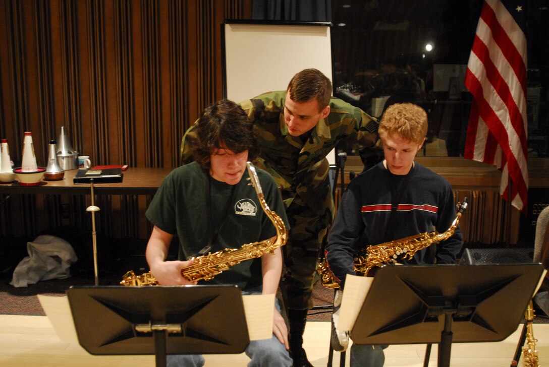 TSgt Ricky Sweum coaches high school saxophone students during a rehearsal for the 2007 Colorado All State Jazz Band.