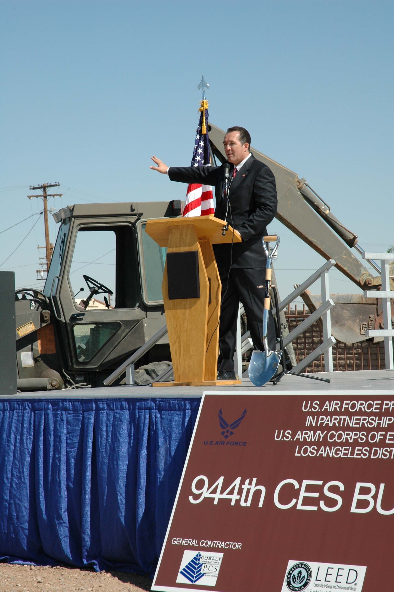 Congressman Trent Franks, 2nd District, Arizona, points to the flightline during a groundbreaking ceremony May 30 at Luke Air Force Base, Ariz., for the new 944th Civil Engineer Squadron as he discusses the sound of freedom with F-16s flying overhead. (U.S. Air Force photo/Tech. Sgt. Susan Stout)