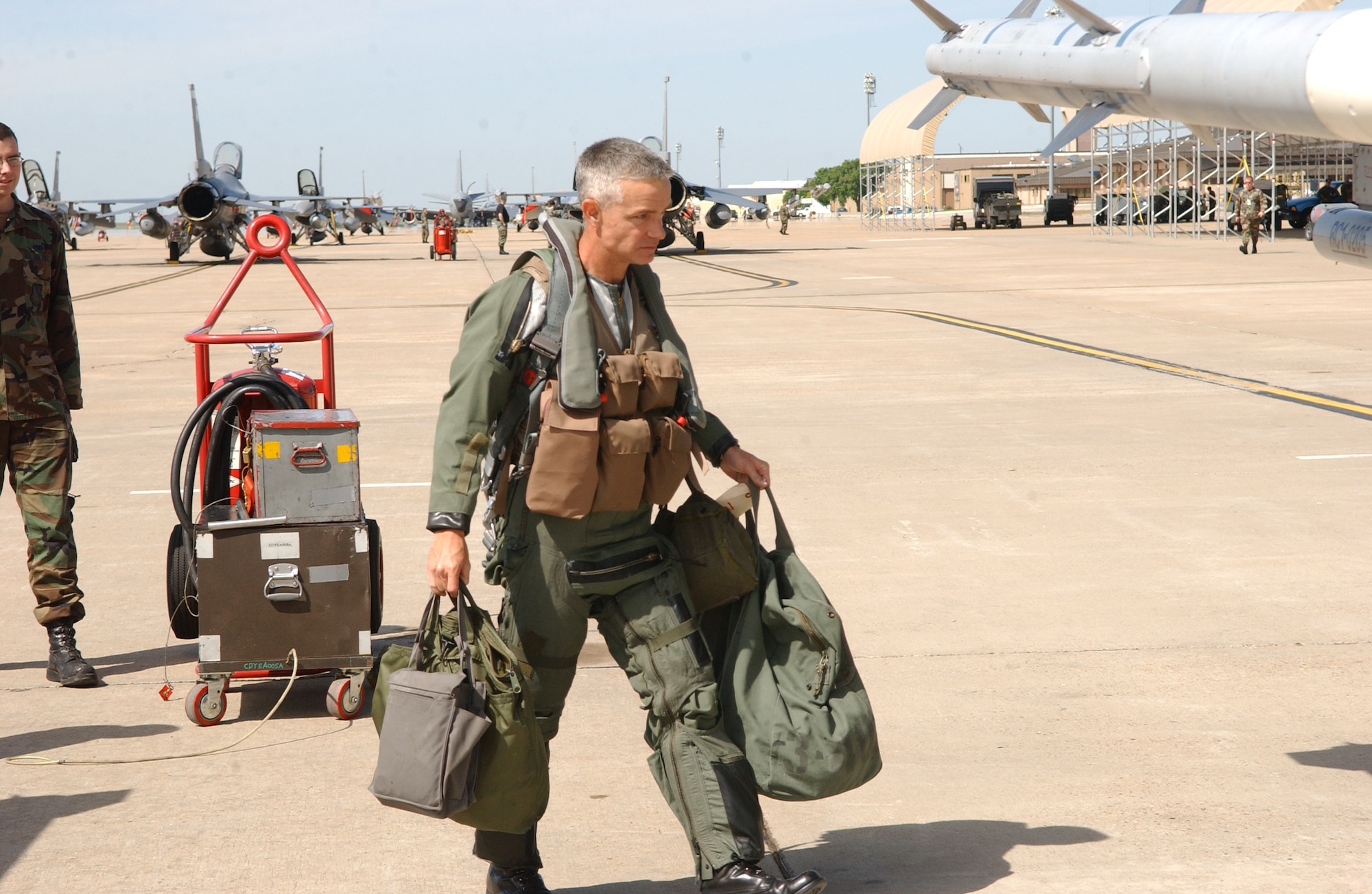 CANNON AIR FORCE BASE, N.M. -- Lt. Col. Tod Fingal, 522nd Fighter Squadron commander, makes his way to his F-16 on May 27. The "Fireballs" arrived at Anderson Air Base, Guam on May 30 to begin a four-month deployment to ensure continued security in the Asia-Pacific region. (U.S. Air Force photo by Tech. Sgt. Scott Mackay) 