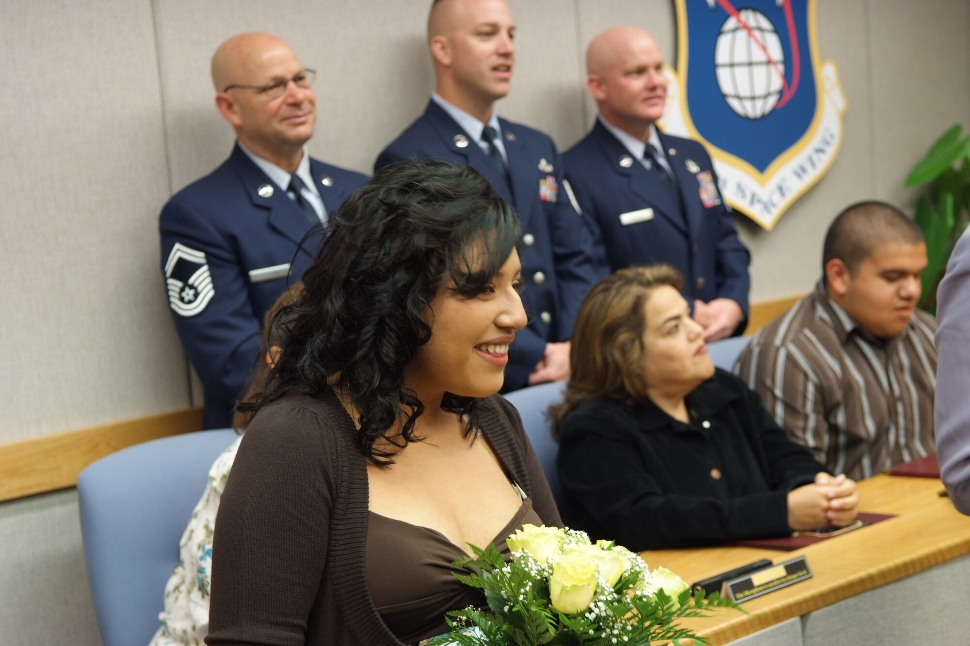 Carolina Garcia of Santa Maria, Calif., talks to her new husband Senior Airman Carlos Moreno, 30th Space Wing Security Forces Squadron. The couple were married minutes earlier via video teleconference here on May 26.  The satellite wedding was a first of its kind at Vandenberg Air Force Base.  Moreno is currently deployed to Afghanistan supporting the war on terror. (U.S. Air Force photo by Tech. Sgt. Scott Seyer)

