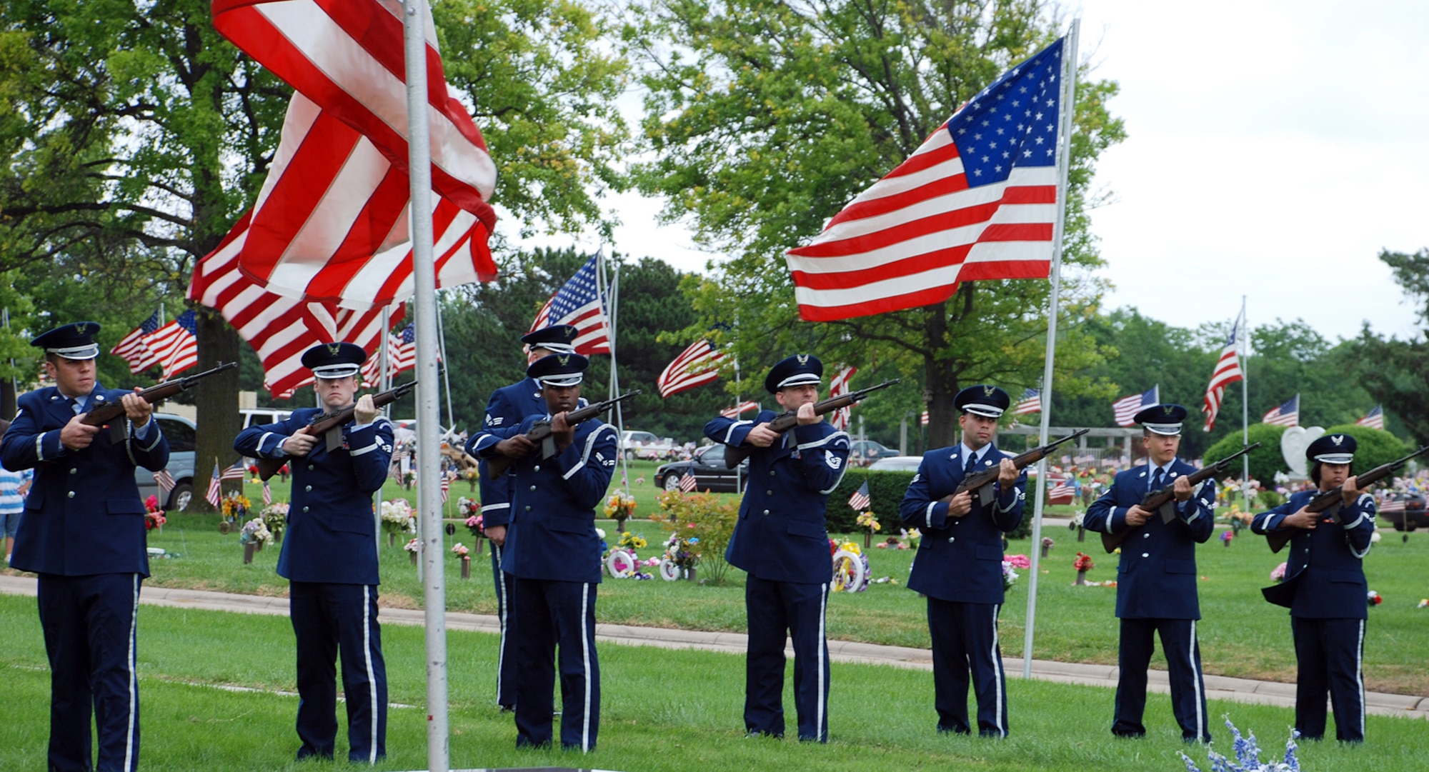 McConnell’s Honor Guard members perform a rifle sequence more commonly known as a 21-gun salute at the 49th annual Memorial Day observance at Resthaven mortuary and cemetery in Wichita, May 28. (Photo by Airman 1st Class Jessica Lockoski)