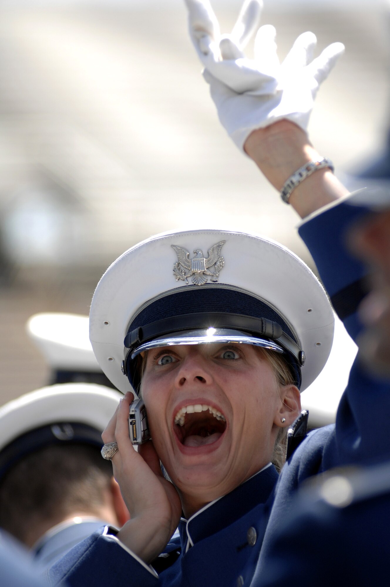 Newly minted 2nd Lt. Heather Moe waves and talks to her family as they celebrate her graduation during the 2007 U.S. Air Force Academy graduation ceremony May 30 in Colorado Springs, Colo. (U.S. Air Force photo/Dennis Rogers)