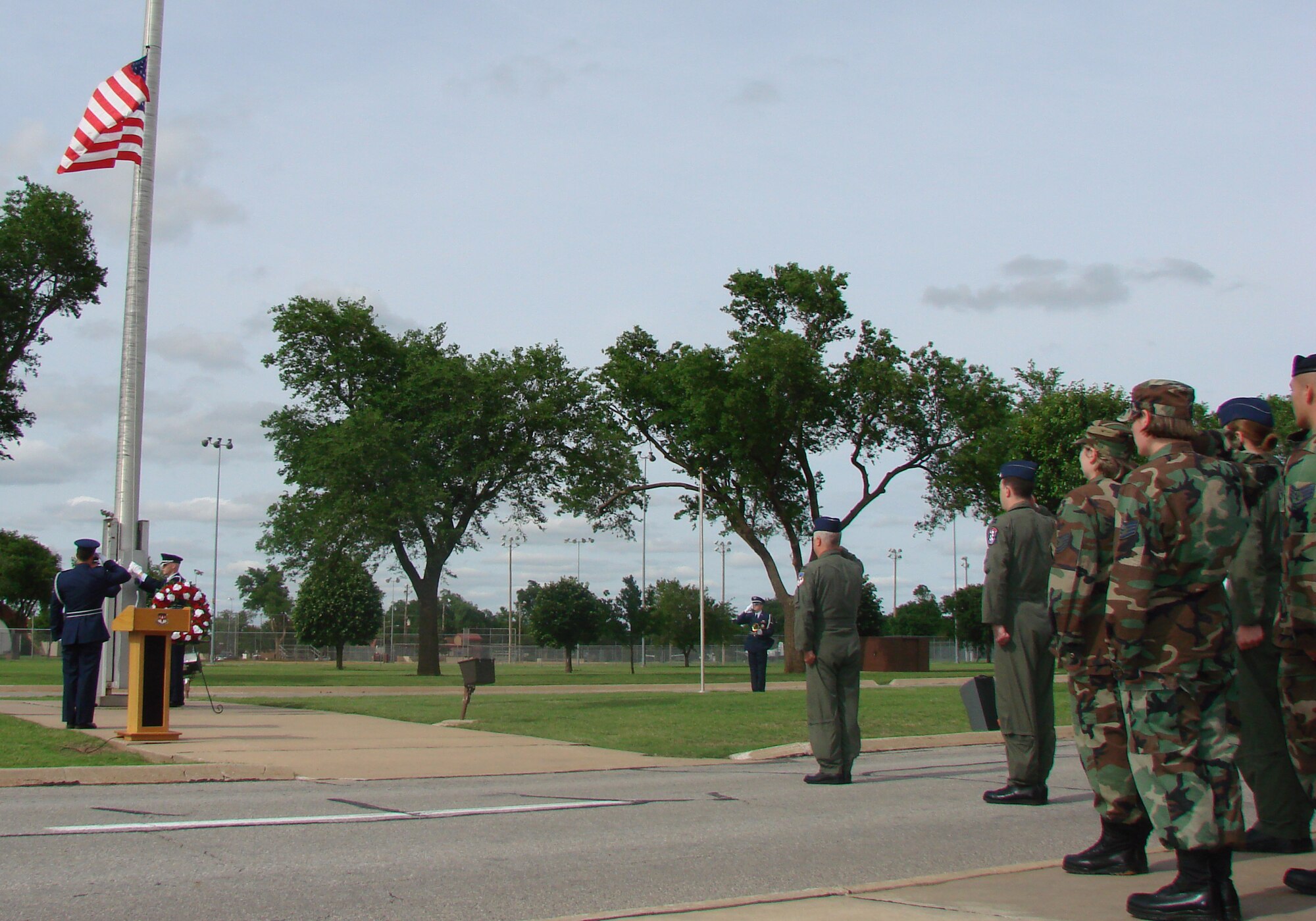 VANCE AIR FORCE BASE, Okla. -- Members of the 71st Flying Training Wing’s honor guard lower the flag during the formal Memorial Day retreat ceremony Thursday. (U.S. Air Force photo by 2nd Lt. Agneta Murnan)  