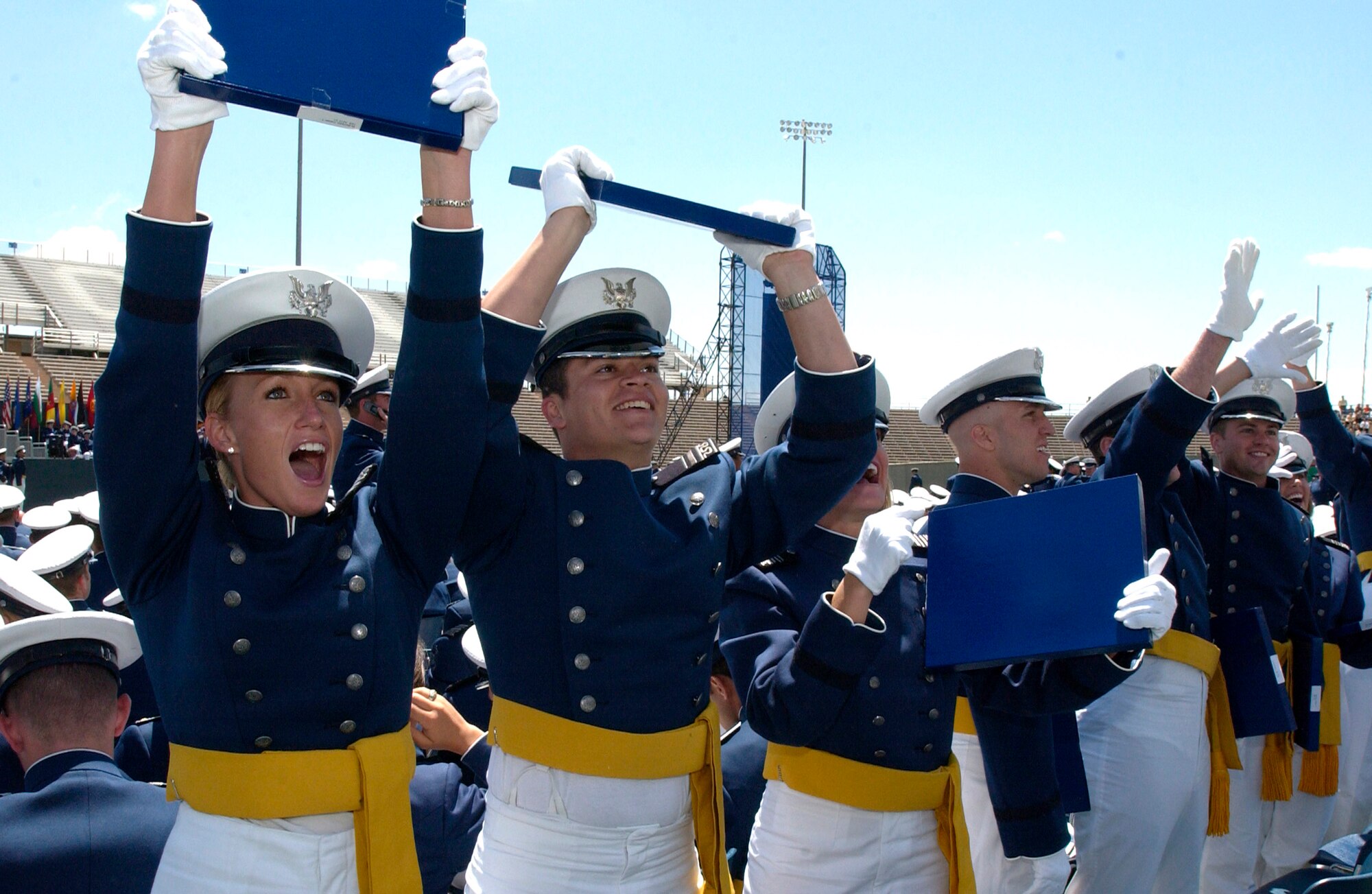 Newly minted 2nd Lieutenants Catlin Butterfield, David Drennan and Kandi Hendershied celebrate during the 2007 U.S. Air Force Academy graduation ceremony May 30 in Colorado Springs, Colo. (U.S. Air Force photo/Mike Kaplan)