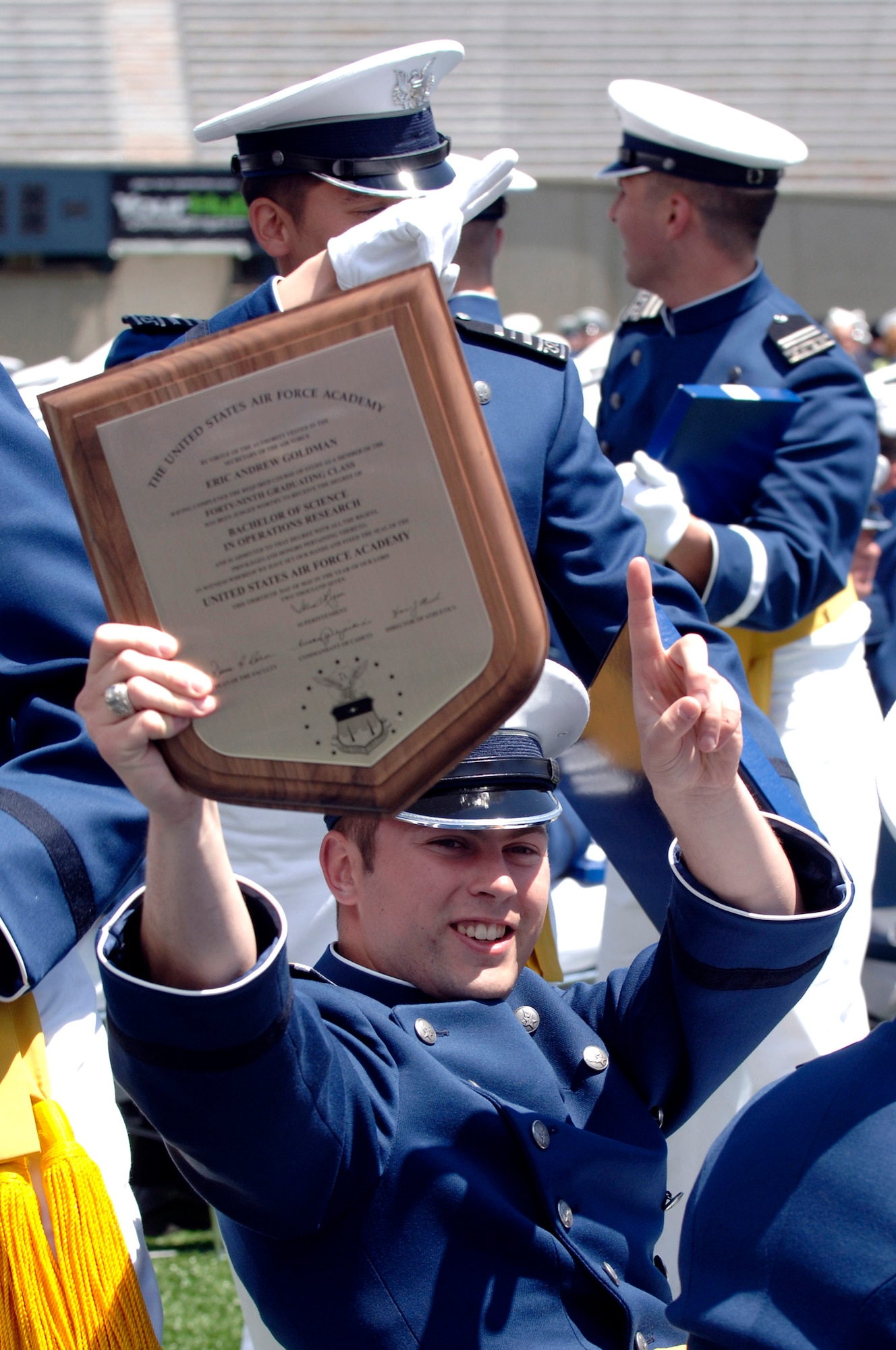 Newly minted 2nd Lt. Eric Goldman holds up his diploma for his friends and family to see during the 2007 U.S. Air Force Academy graduation ceremony May 30 in Colorado Springs, Colo. (U.S. Air Force photo/Mike Kaplan) 